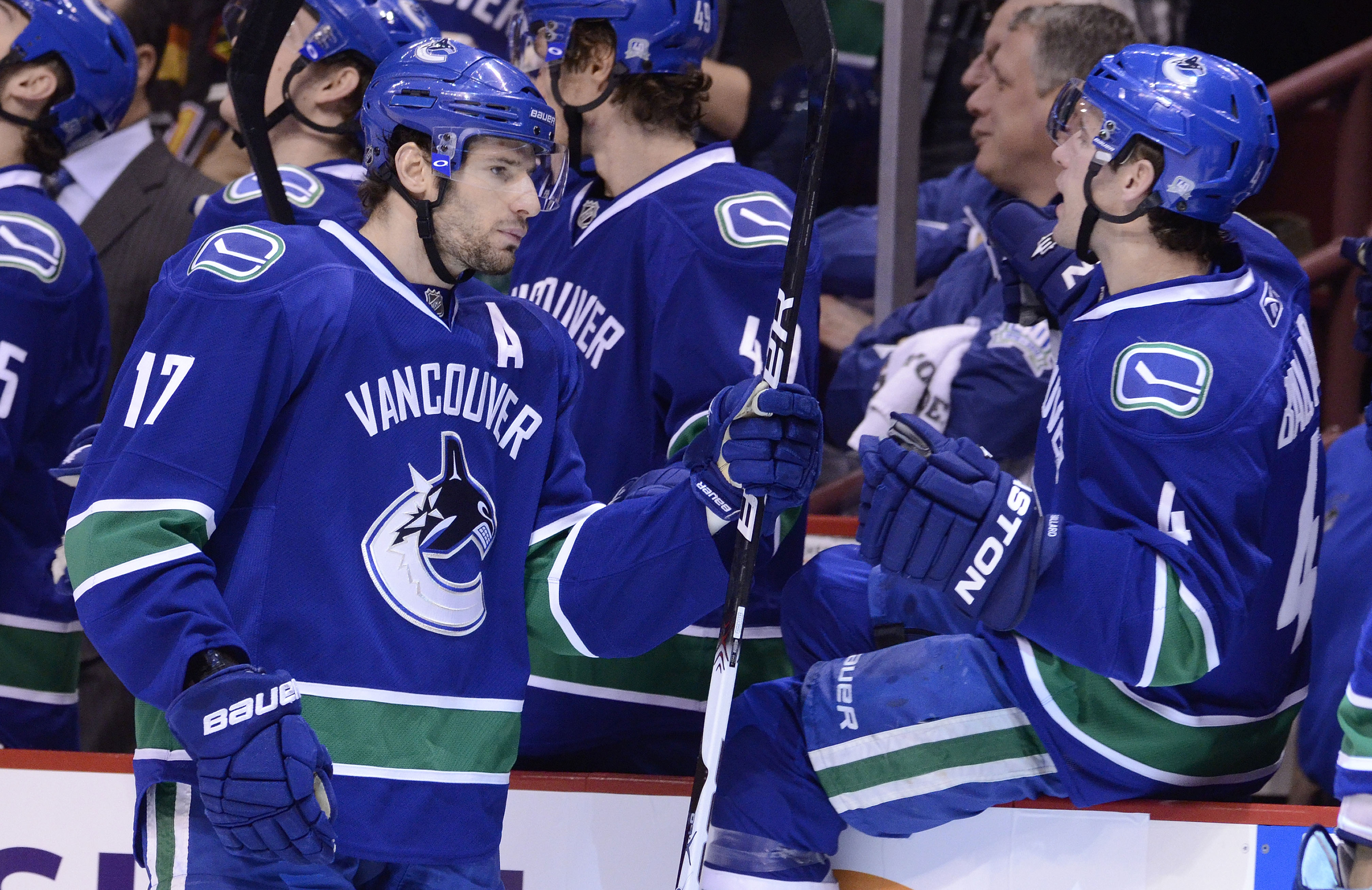 VANCOUVER, CANADA - JANUARY 5: Ryan Kesler #17 of the Vancouver Canucks is congratulated by Keith Ballard #4 after scoring against the Calgary Flames during the first period in NHL action on January 05, 2011 at Rogers Arena in Vancouver, BC, Canada.  (Pho