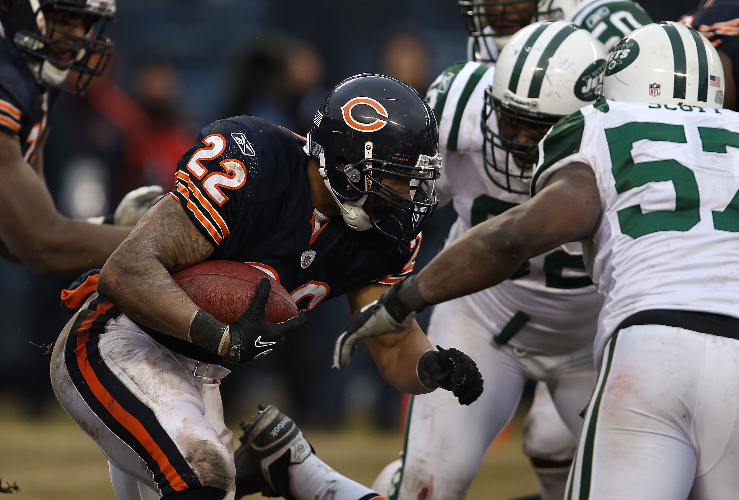 CHICAGO, IL - DECEMBER 26: Matt Forte #22 of the Chicago Bears runs against Bart Scott #57 and Shaun Ellis #92 of the New York Jets at Soldier Field on December 26, 2010 in Chicago, Illinois. The Bears defeated the Jets 38-34. (Photo by Jonathan Daniel/Ge CHICAGO, IL - DECEMBER 26: Matt Forte #22 of the Chicago Bears runs against Bart Scott #57 and Shaun Ellis #92 of the New York Jets at Soldier Field on December 26, 2010 in Chicago, Illinois. The Bears defeated the Jets 38-34. (Photo by Jonathan Daniel/Ge