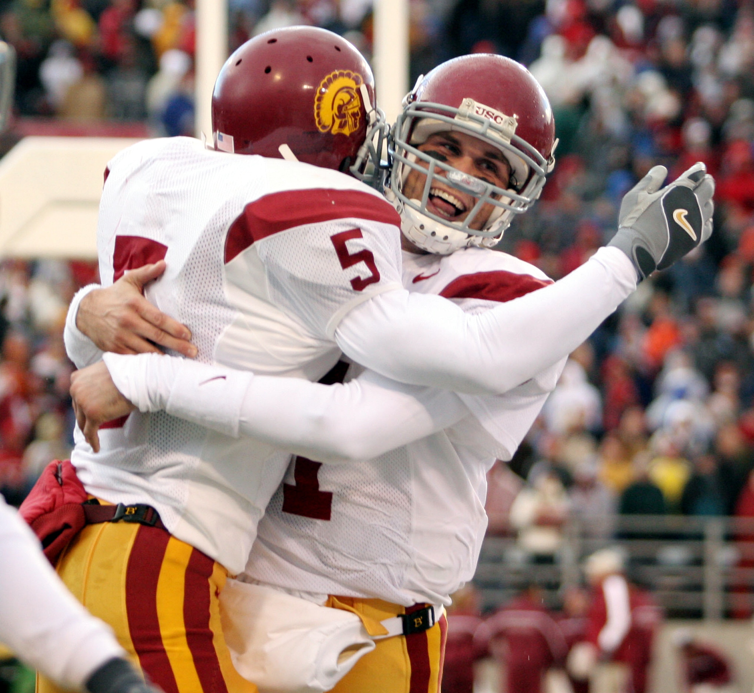 PULLMAN, WA - OCTOBER 30:  Running back Reggie Bush #5 of the USC Trojans celebrates with quarterback Matt Leinart #11 after scoring a touchdown against the Washington State Cougars on October 30, 2004 at Martin Stadium in Pullman, Washington.  (Photo by