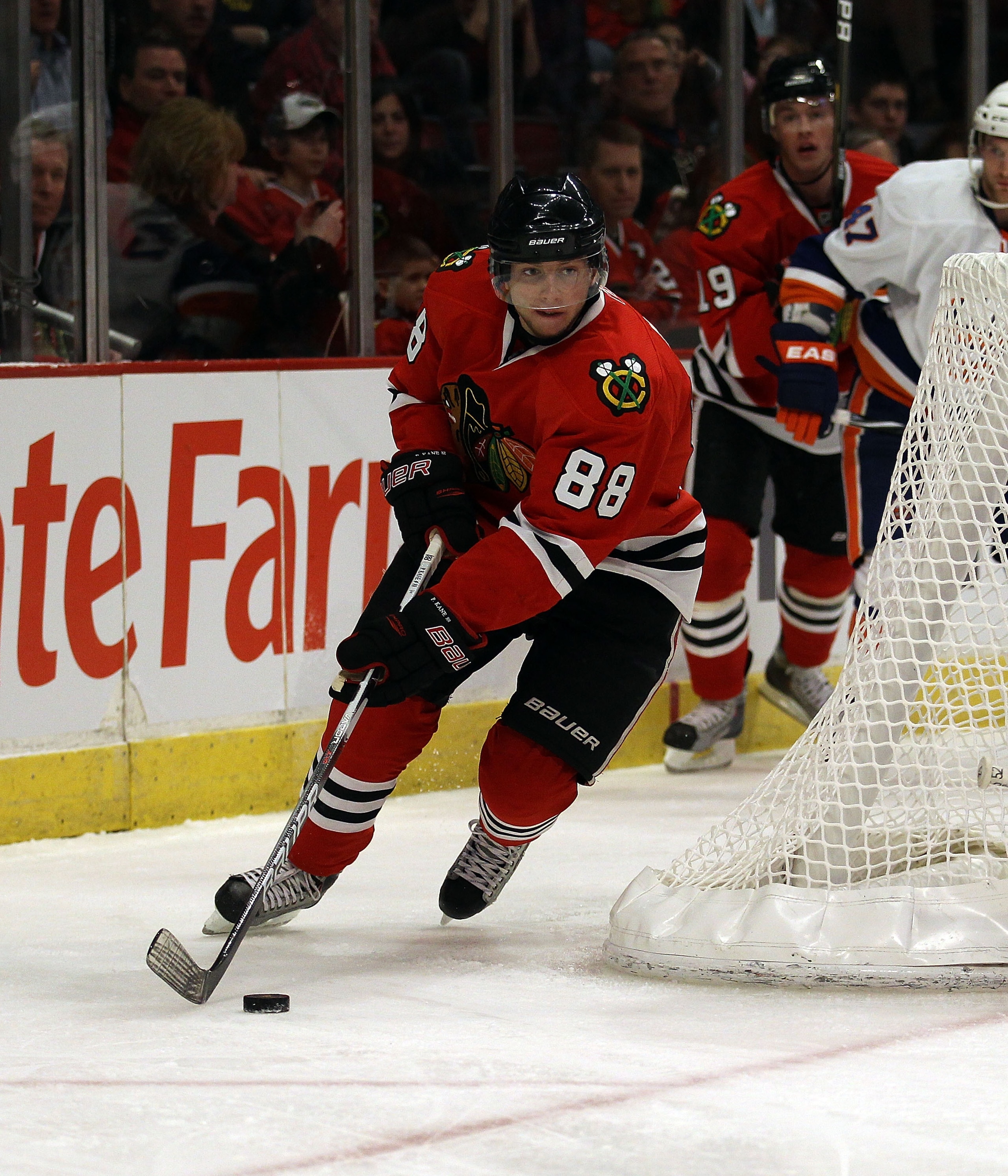CHICAGO, IL - JANUARY 09: Patrick Kane #88 of the Chicago Blackhawks moves around the net against the New York Islanders at the United Center on January 9, 2011 in Chicago, Illinois. The Blackhawks defeated the Islanders 5-0. (Photo by Jonathan Daniel/Get