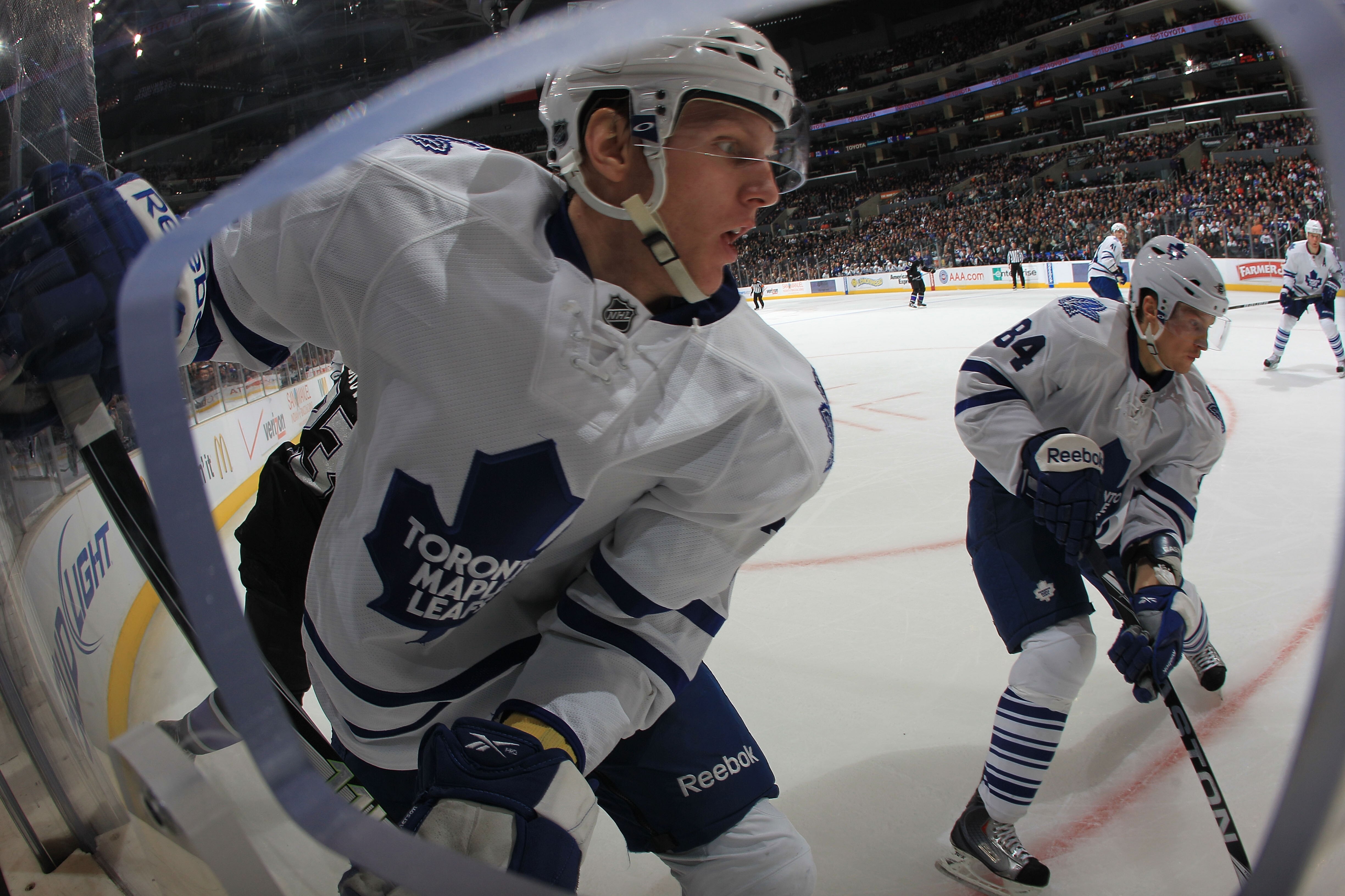 LOS ANGELES, CA - JANUARY 10: Carl Gunnarsson #36 and Mikhail Grabovski #84 of the Toronto Maple Leafs skate against the Los Angeles Kings at the Staples Center on January 10, 2011 in Los Angeles, California. The Leafs defeated the Kings 3-2. (Photo by Br