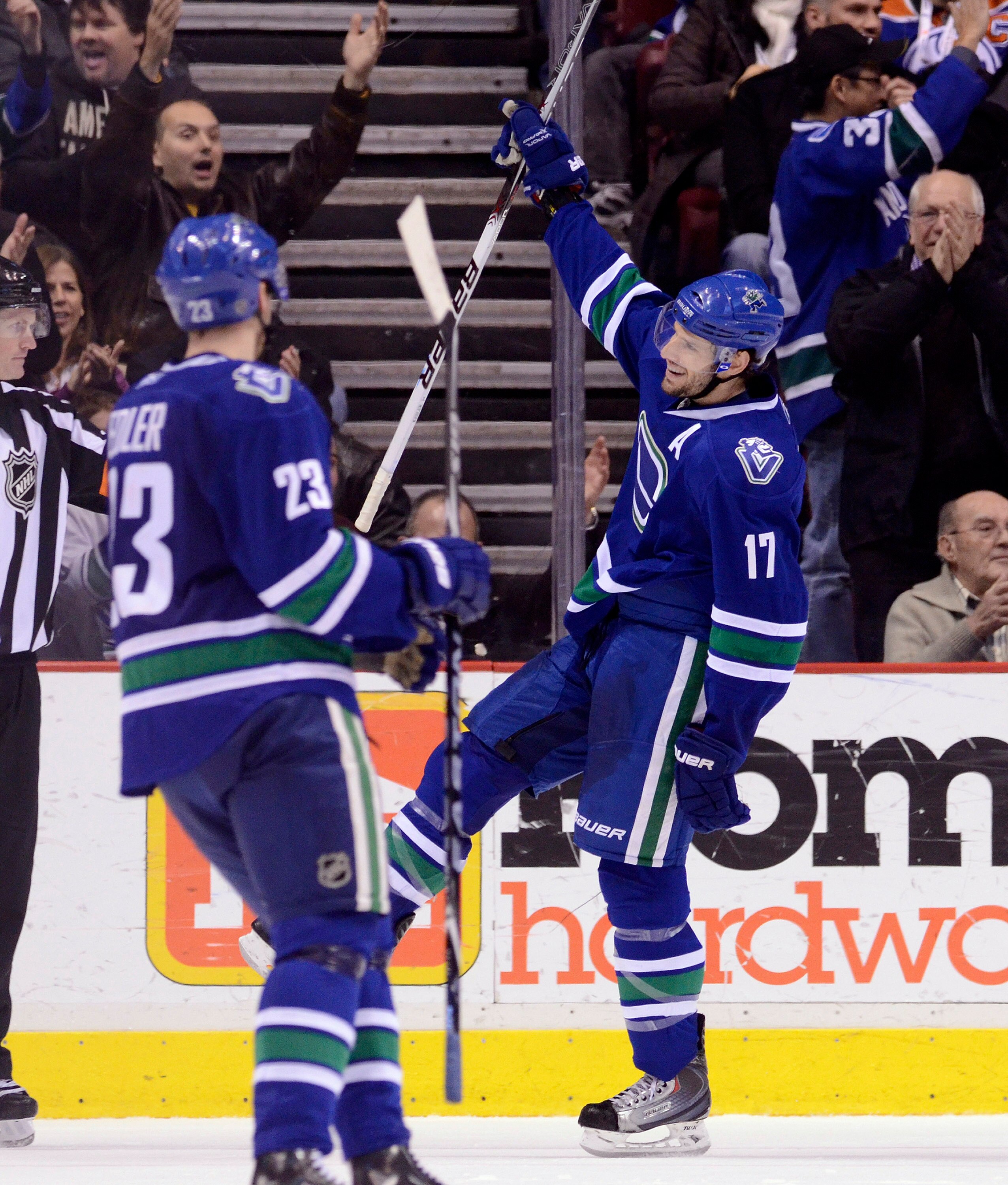VANCOUVER, CANADA - JANUARY 7: Ryan Kesler #17 of the Vancouver Canucks celebrates with teammate Alexander Edler #23 after scoring against the Edmonton Oilers during the third period at Rogers Arena January 7, 2011 in Vancouver, BC, Canada.  (Photo by Ric