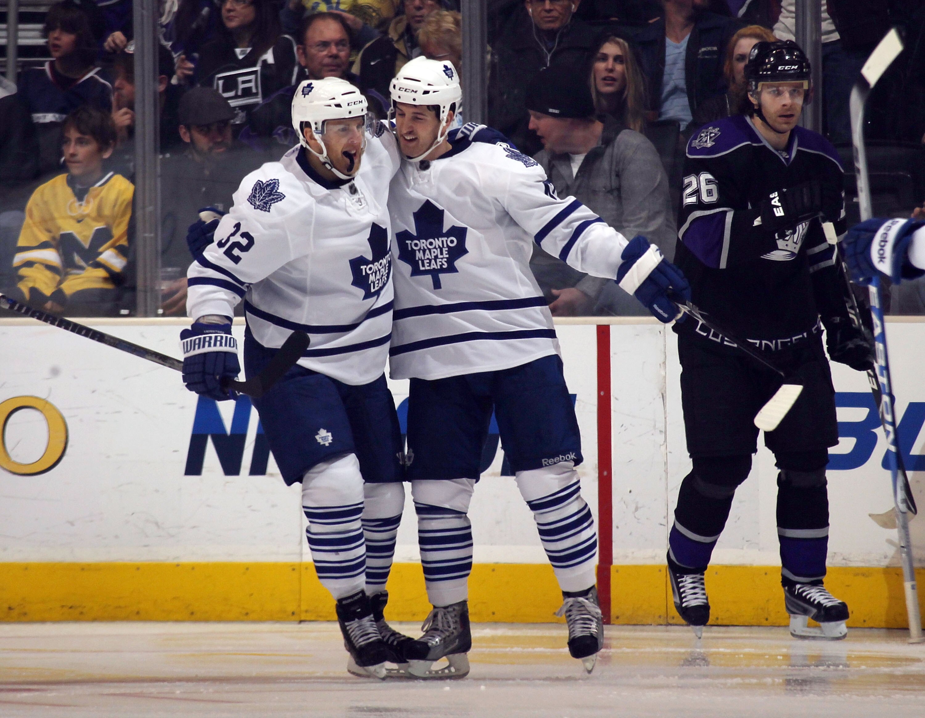 LOS ANGELES, CA - JANUARY 10: Kris Versteeg #32 of the Toronto Maple Leafs hugs Darryl Boyce #47 following Boyce's goal at 2:27 of the second period against Los Angeles Kings at the Staples Center on January 10, 2011 in Los Angeles, California.  (Photo by