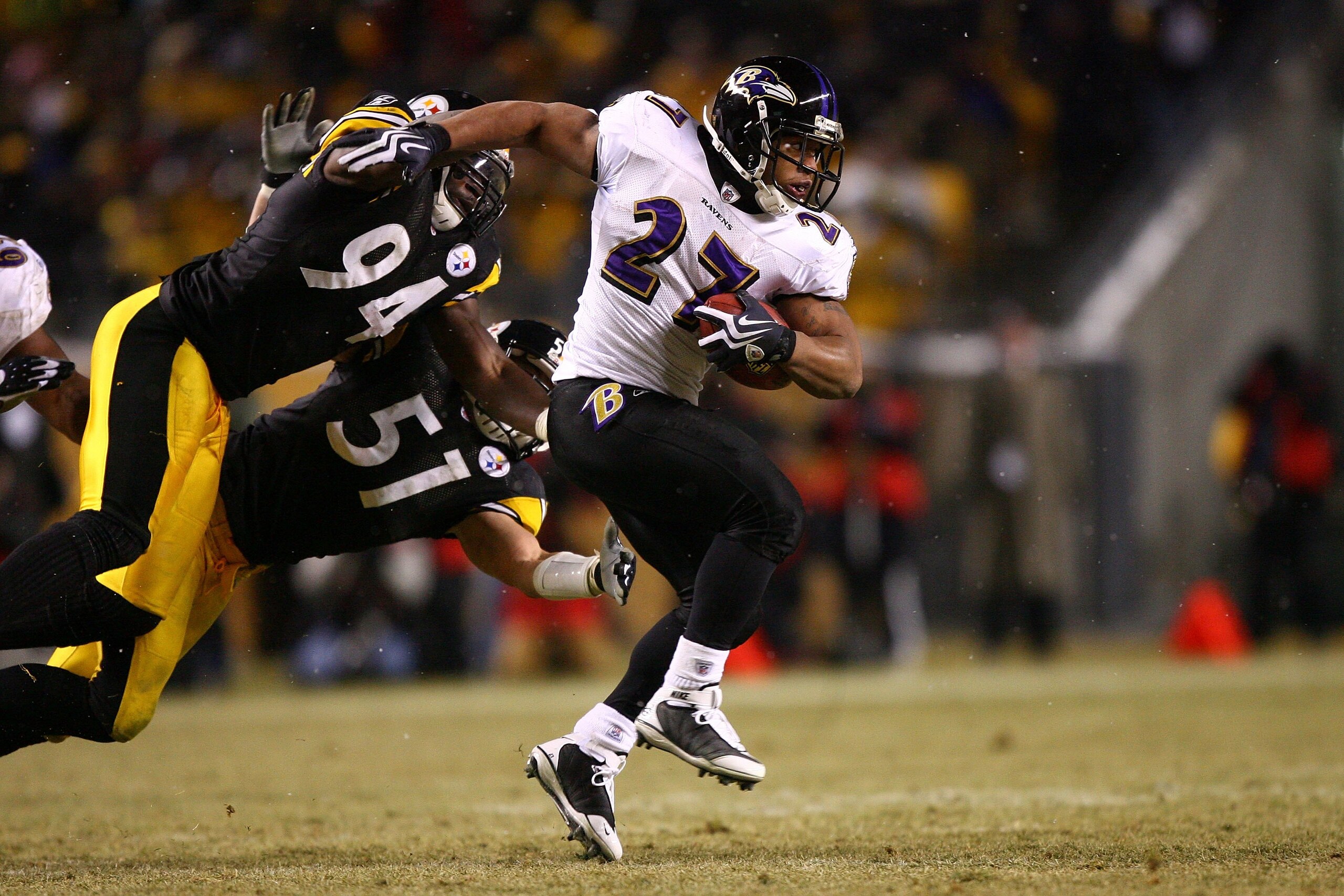 PITTSBURGH - JANUARY 18: Ray Rice #27 of the Baltimore Ravens runs with the ball against Lawrence Timmons #94 and James Farrior #51 of the Pittsburgh Steelers during the AFC Championship game on January 18, 2009 at Heinz Field in Pittsburgh, Pennsylvania PITTSBURGH - JANUARY 18: Ray Rice #27 of the Baltimore Ravens runs with the ball against Lawrence Timmons #94 and James Farrior #51 of the Pittsburgh Steelers during the AFC Championship game on January 18, 2009 at Heinz Field in Pittsburgh, Pennsylvania