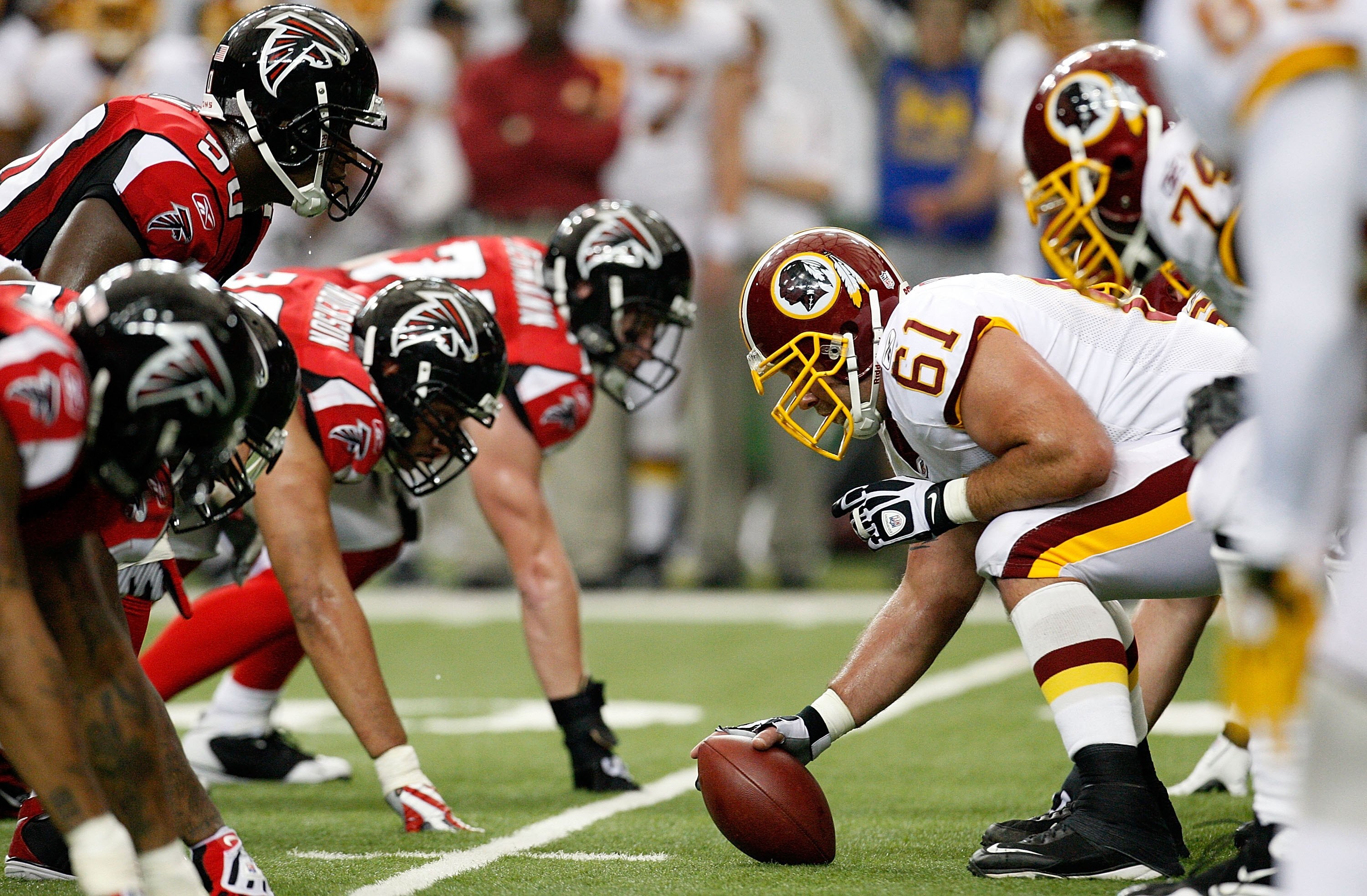 ATLANTA - NOVEMBER 08:  Curtis Lofton #50 of the Atlanta Falcons hovers over center Casey Rabach #61 of the Washington Redskins at Georgia Dome on November 8, 2009 in Atlanta, Georgia.  (Photo by Kevin C. Cox/Getty Images)