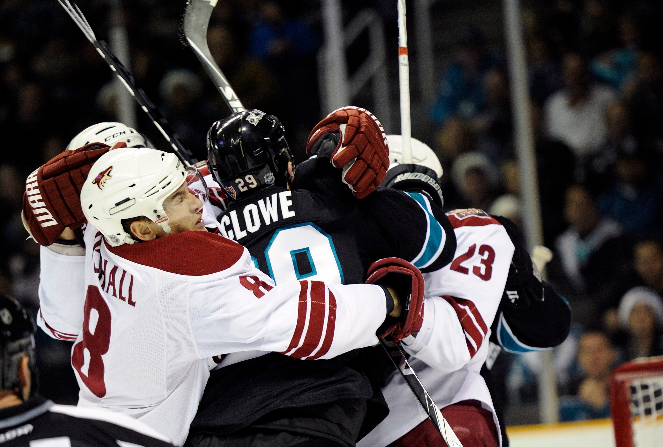 SAN JOSE, CA - DECEMBER 23: Ryane Clowe #29 of the San Jose Sharks is grabbed by Scottie Upshall #8 and Oliver Ekman-Larsson #23 of the Phoenix Coyotes during the 2nd period of an NHL hockey game at the HP Pavilion on December 23, 2010 in San Jose, Califo
