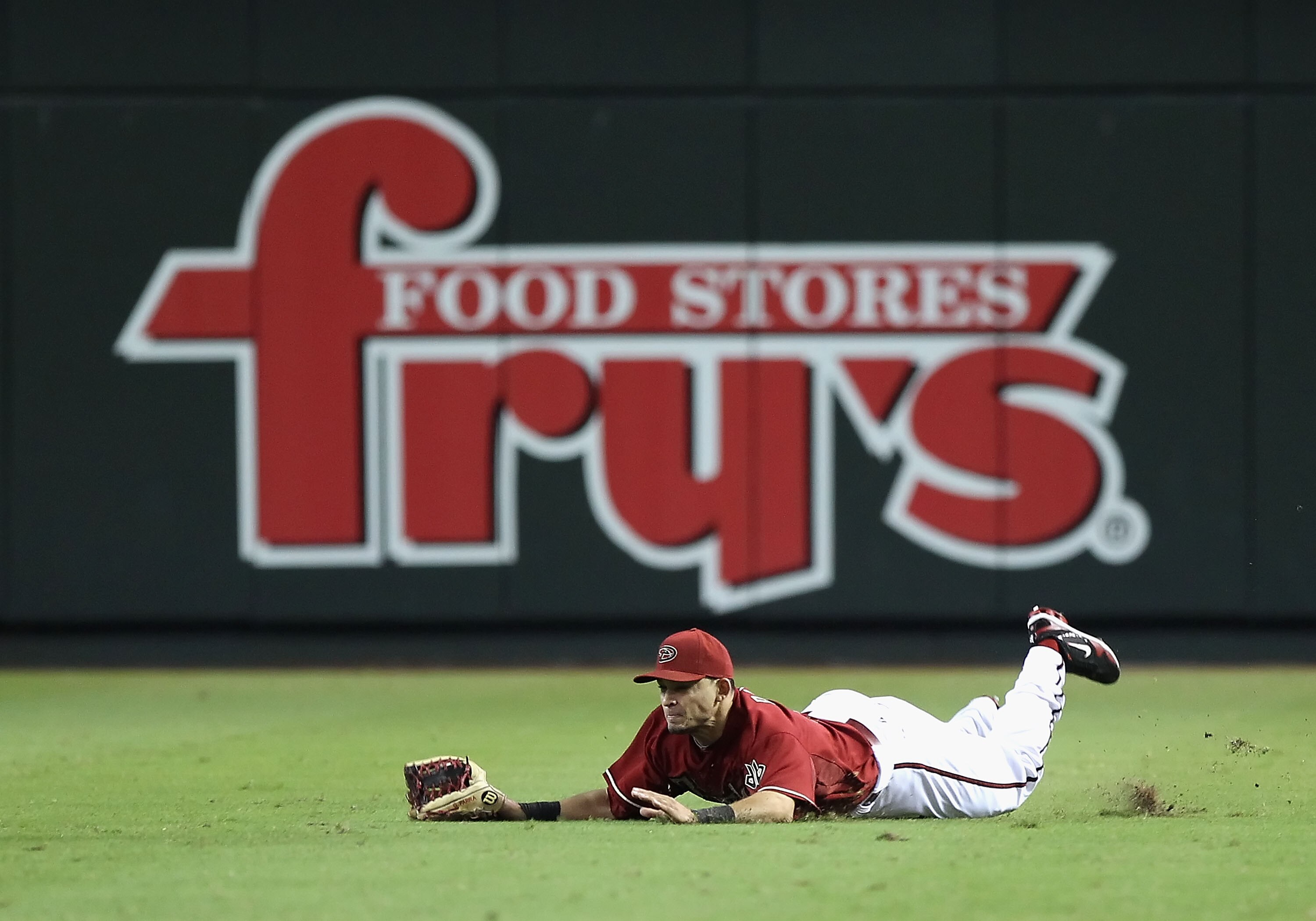 PHOENIX - SEPTEMBER 06:  Outfielder Gerardo Parra #18 of the Arizona Diamondbacks makes a diving catch during the Major League Baseball game against the San Francisco Giants at Chase Field on September 6, 2010 in Phoenix, Arizona. The Giants defeated the
