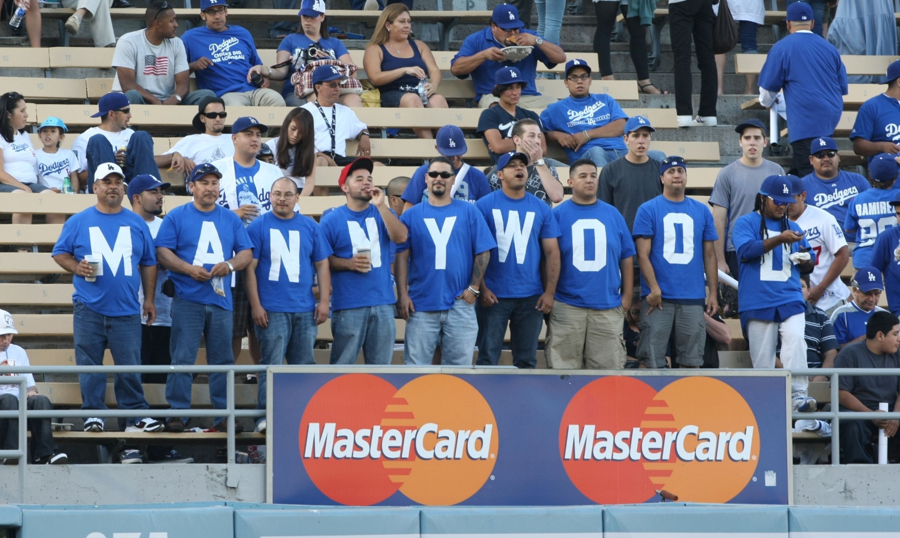 LOS ANGELES - JULY 16: Fans of the Los Angeles Dodgers looks on prior to the game against the Houston Astros on July 16, 2009 at Dodger Stadium in Los Angeles, California. (Photo by Stephen Dunn/Getty Images)