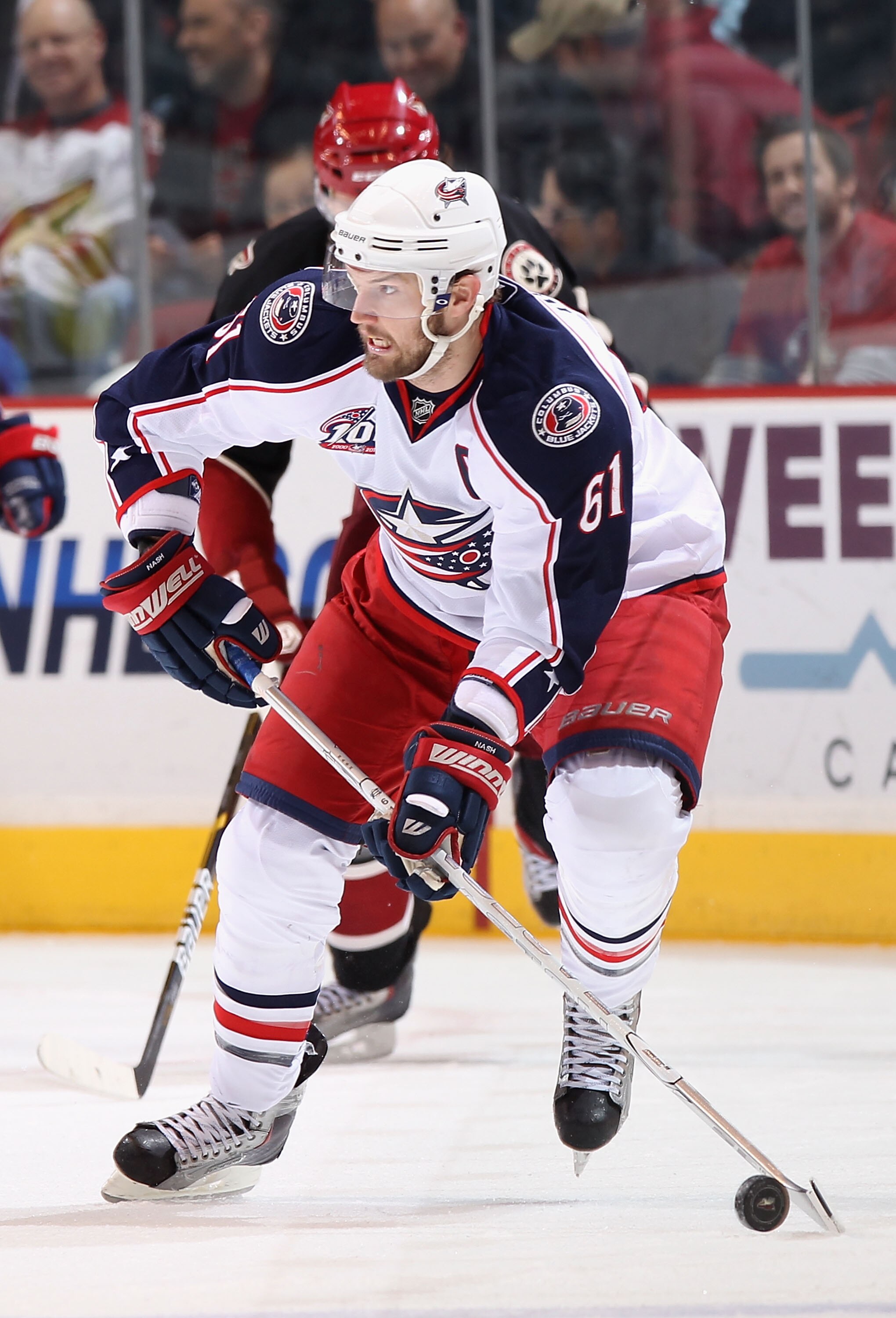 GLENDALE, AZ - JANUARY 04:  Rick Nash #61 of the Columbus Blue Jackets skates with the puck during the NHL game against the Phoenix Coyotes at Jobing.com Arena on January 4, 2011 in Glendale, Arizona.  The Coyotes defeated the Blue Jackets 4-2.  (Photo by