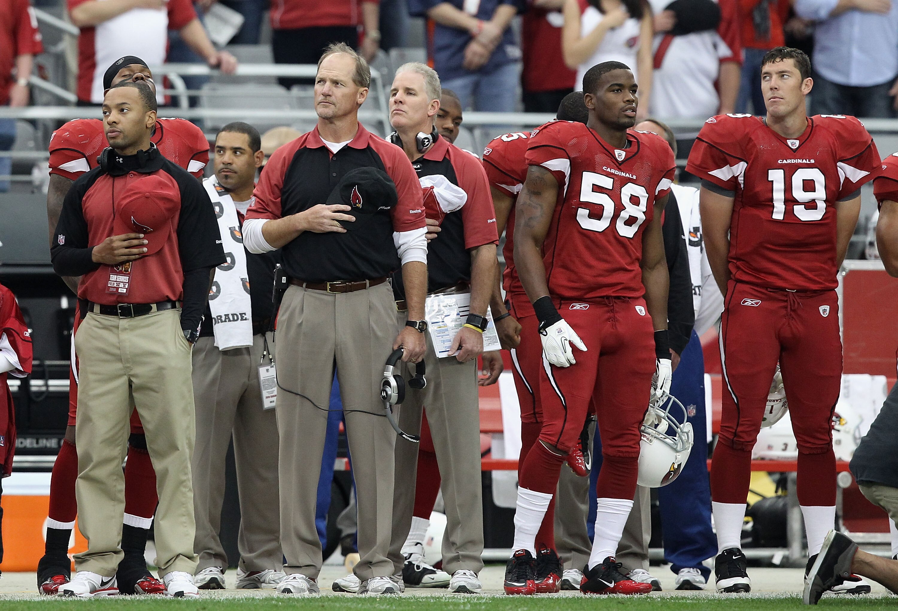 GLENDALE, AZ - DECEMBER 12:  Head coach Ken Whisenhunt of the Arizona Cardinals stands attended for the National Anthem before the NFL game against the Denver Broncos at the University of Phoenix Stadium on December 12, 2010 in Glendale, Arizona.  (Photo