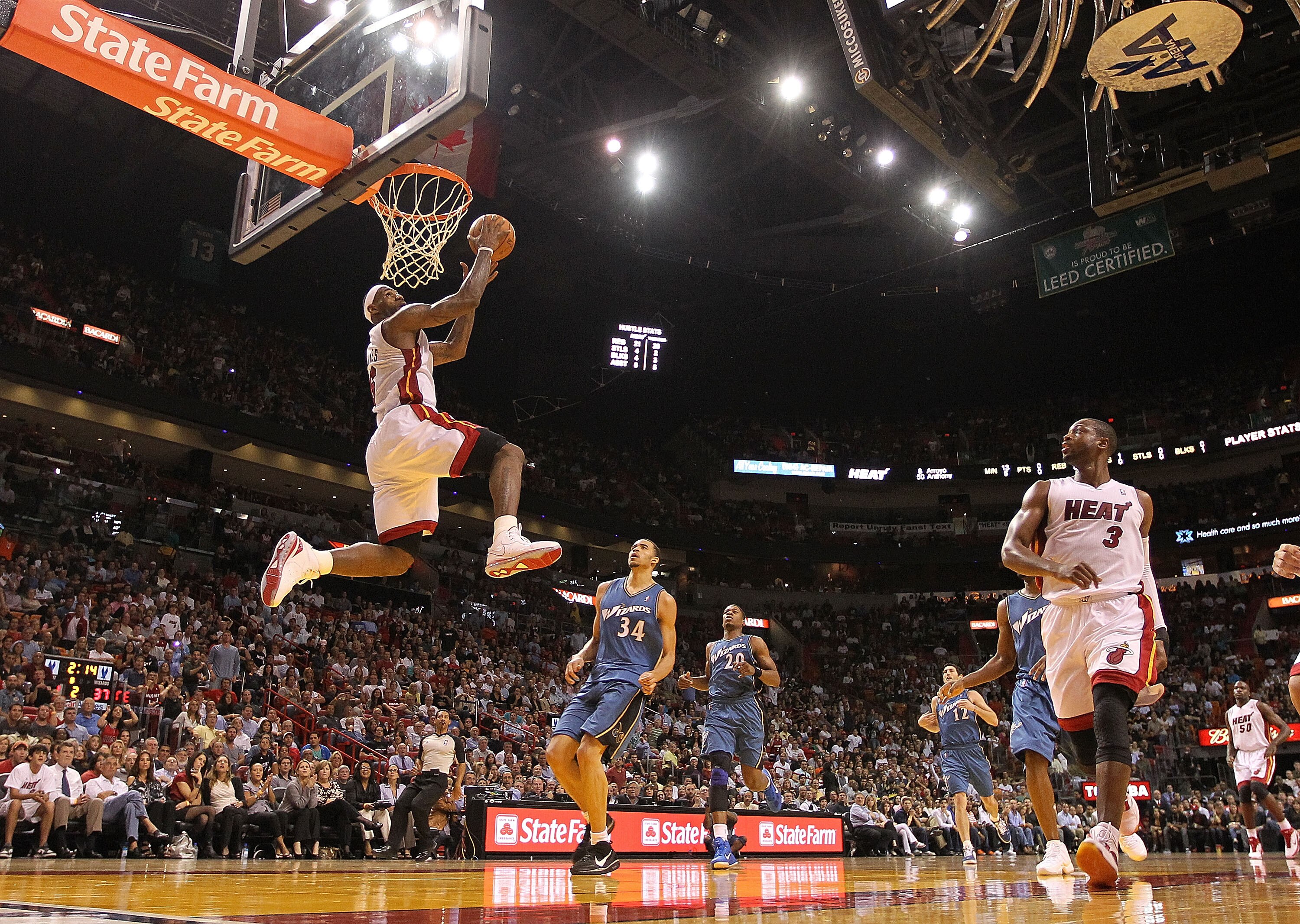 MIAMI, FL - NOVEMBER 29:  LeBron James #6 of the Miami Heat dunks during a game against the Washington Wizards at American Airlines Arena on November 29, 2010 in Miami, Florida. NOTE TO USER: User expressly acknowledges and agrees that, by downloading and