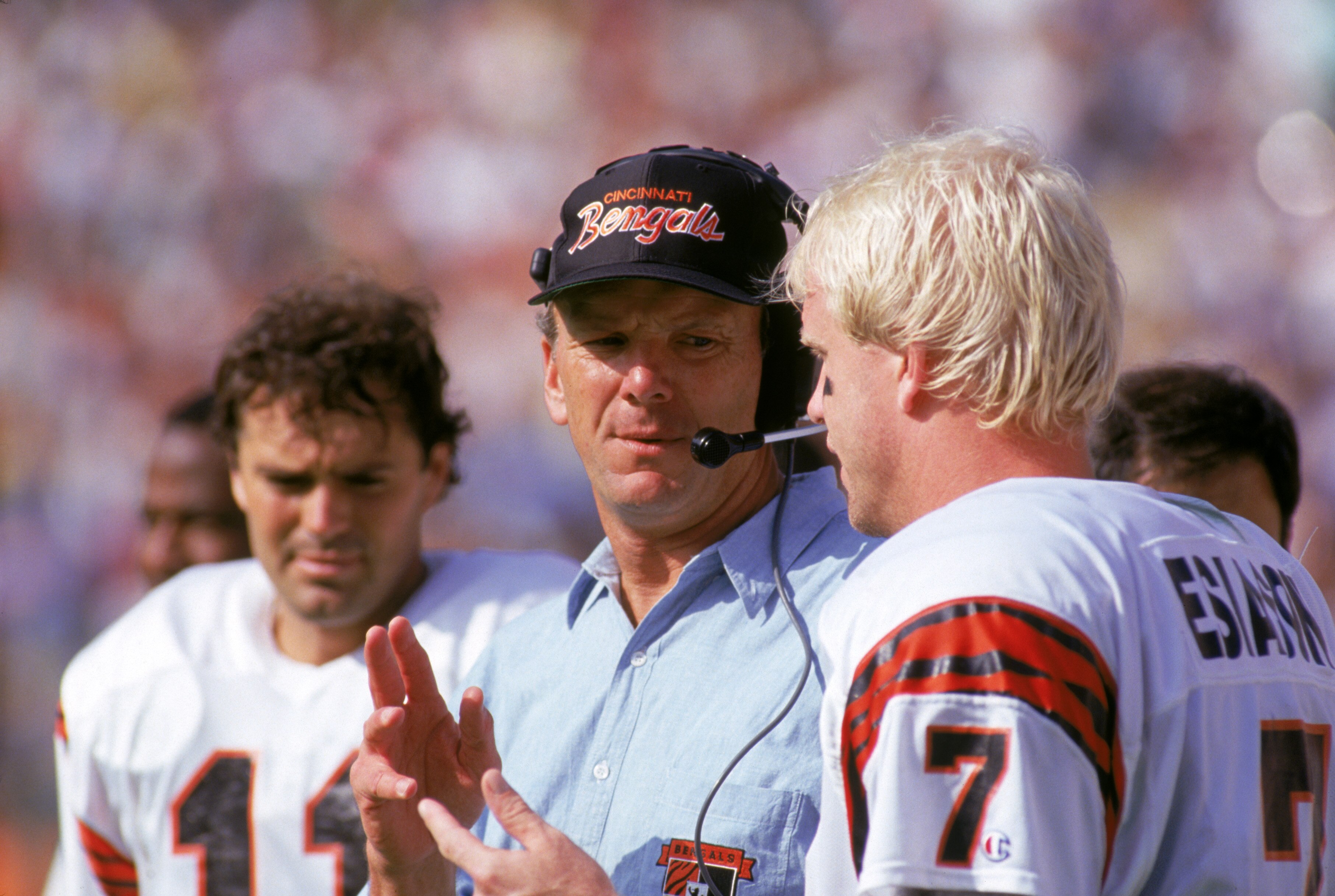 ANAHEIM, CA - OCTOBER 7:  Head coach Sam Wyche of the Cincinnati Bengals talks to his quarterback Boomer Esiason #7 on the sidelines during a game against the Los Angeles Rams at the Anaheim Stadium on October 7, 1990 in Anaheim, California.  The Bengals
