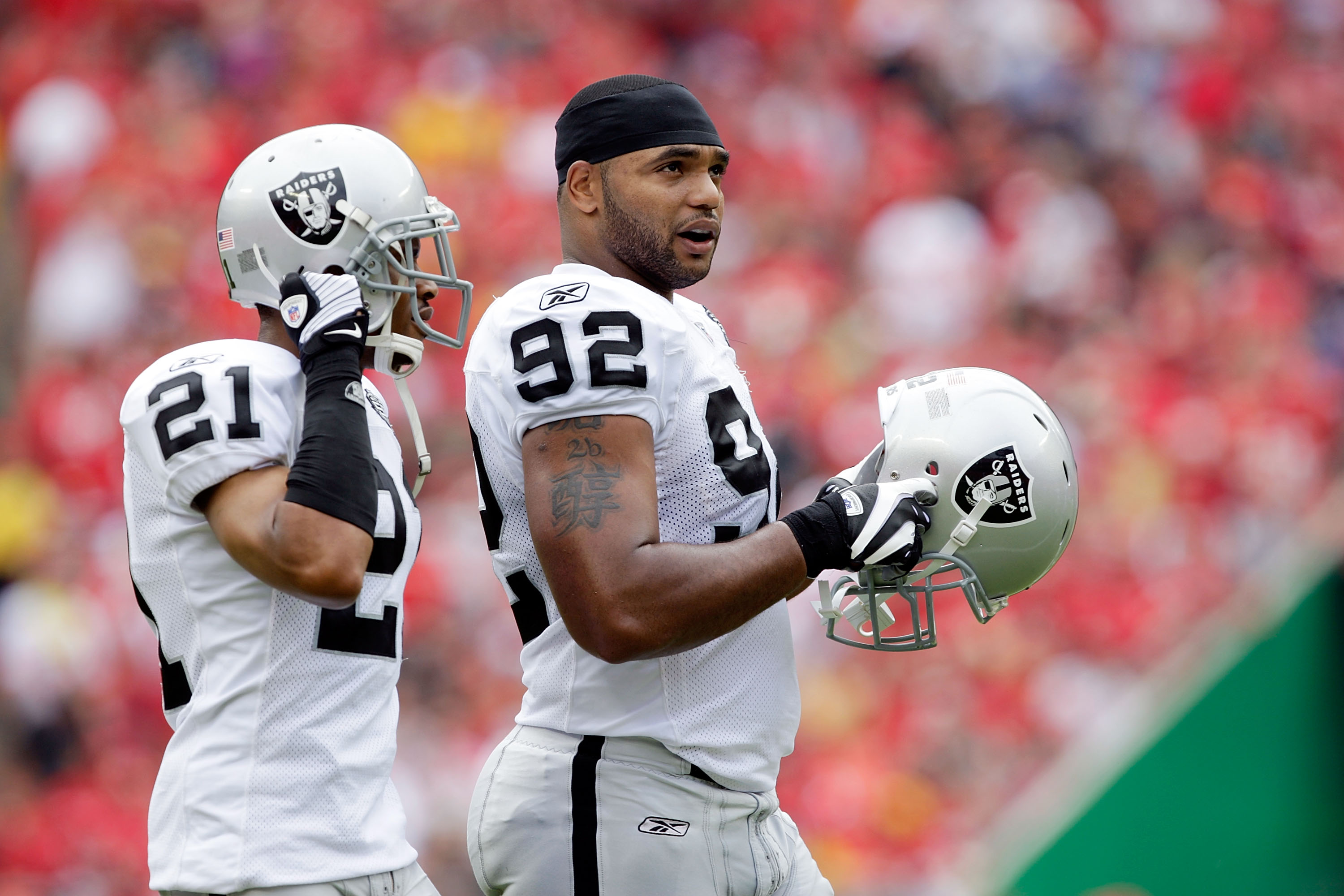 KANSAS CITY, MO - SEPTEMBER 20:  Defensive end Richard Seymour #92 of the Oakland Raiders walks onto the field with Nnamdi Asomugha #21 during the game against the Kansas City Chiefs at Arrowhead Stadium on September 20, 2009 in Kansas City, Missouri.  (P