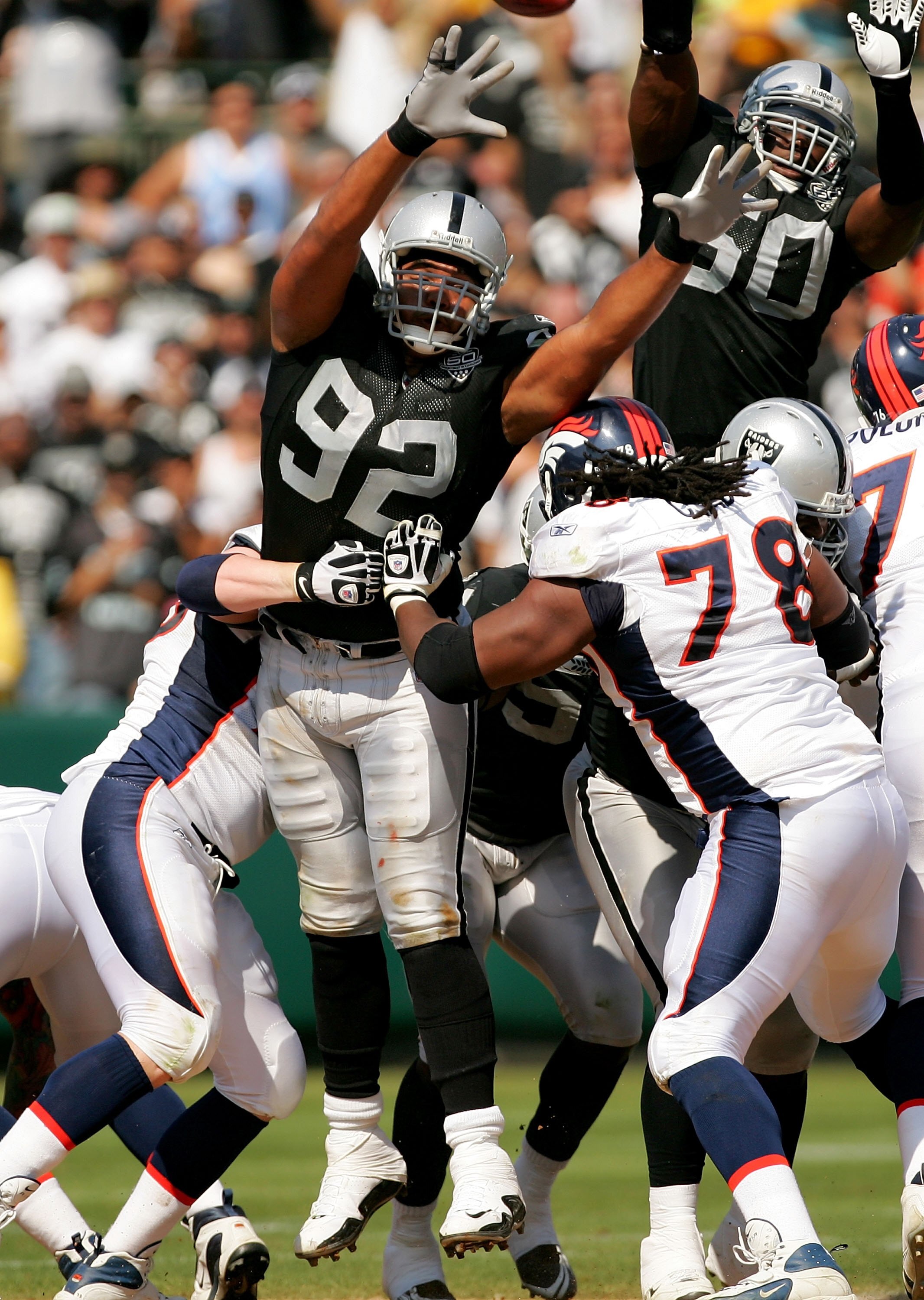 OAKLAND, CA - SEPTEMBER 27:  Richard Seymour #92 of the Oakland Raiders jumps in hopes of blocking a field goal during their game against the Denver Broncos at the Oakland-Alameda County Coliseum on September 27, 2009 in Oakland, California.  (Photo by Ez