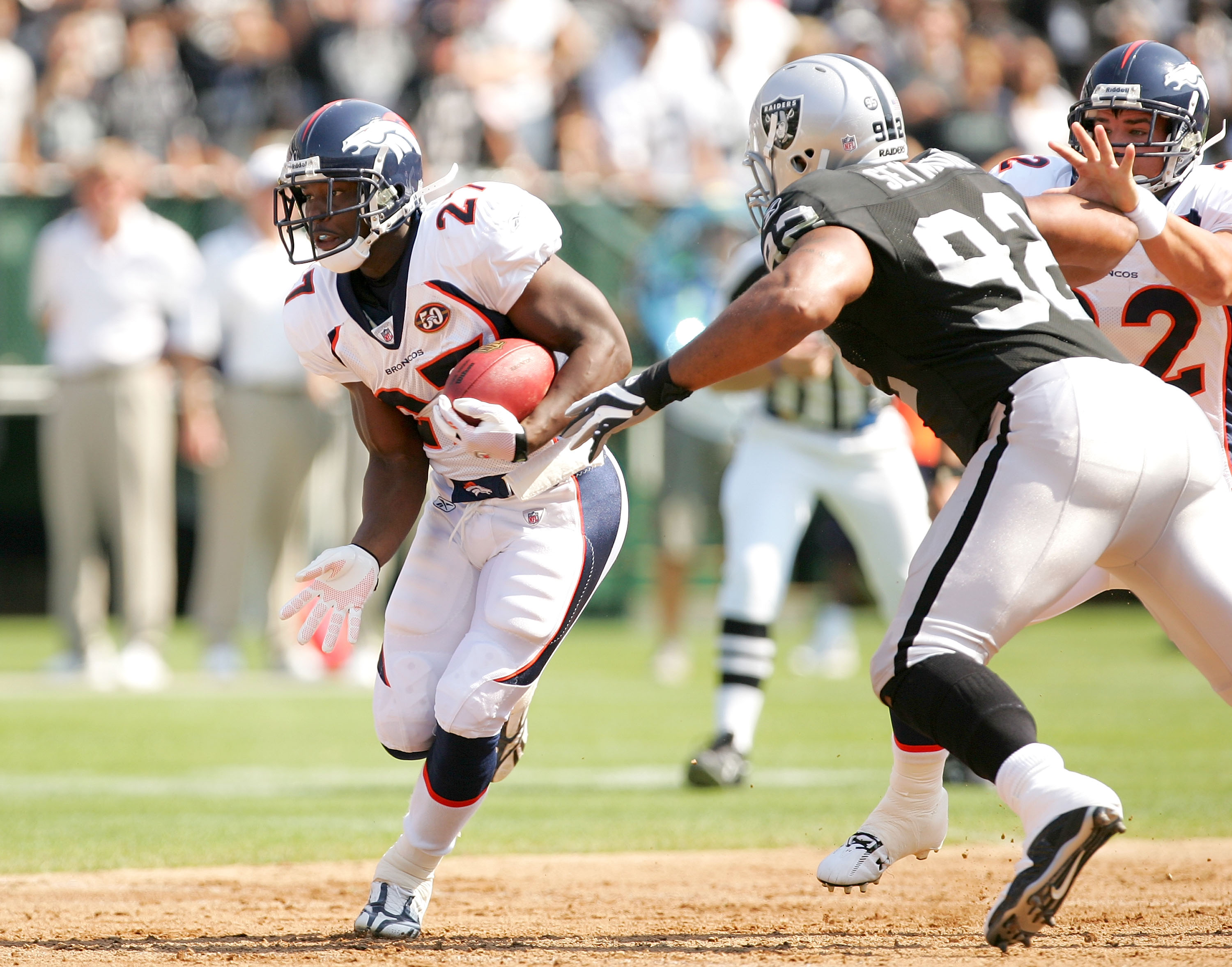 OAKLAND, CA - SEPTEMBER 27:  Knowshon Moreno #27 of the Denver Broncos runs past Richard Seymour #92 of the Oakland Raiders at the Oakland-Alameda County Coliseum on September 27, 2009 in Oakland, California.  (Photo by Ezra Shaw/Getty Images)