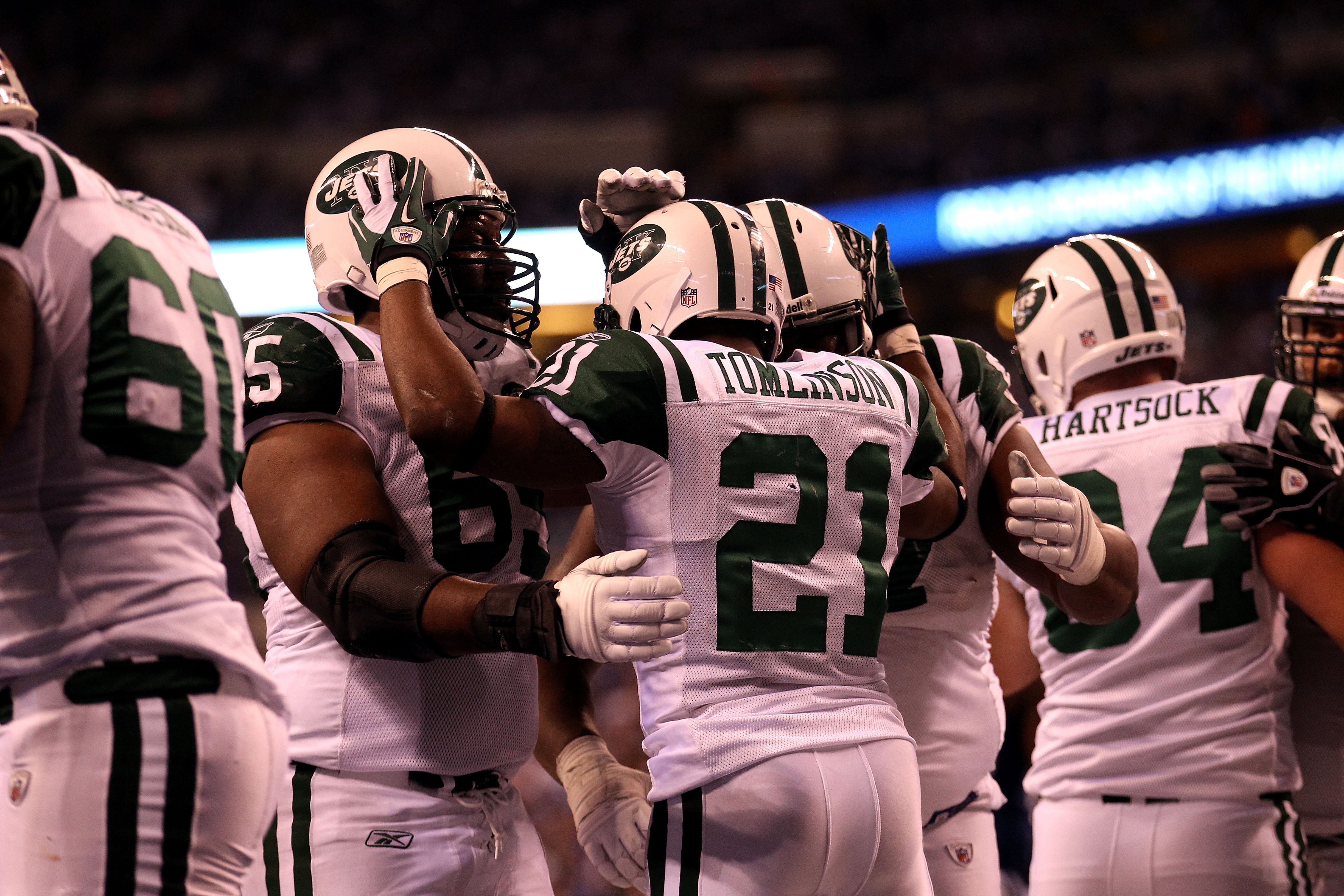 INDIANAPOLIS, IN - JANUARY 08:  LaDainian Tomlinson #21 of the New York Jets celebrateswith teammates after he scored a 1-yard rushing touchdown in the fourth quarter against the Indianapolis Colts during their 2011 AFC wild card playoff game at Lucas Oil