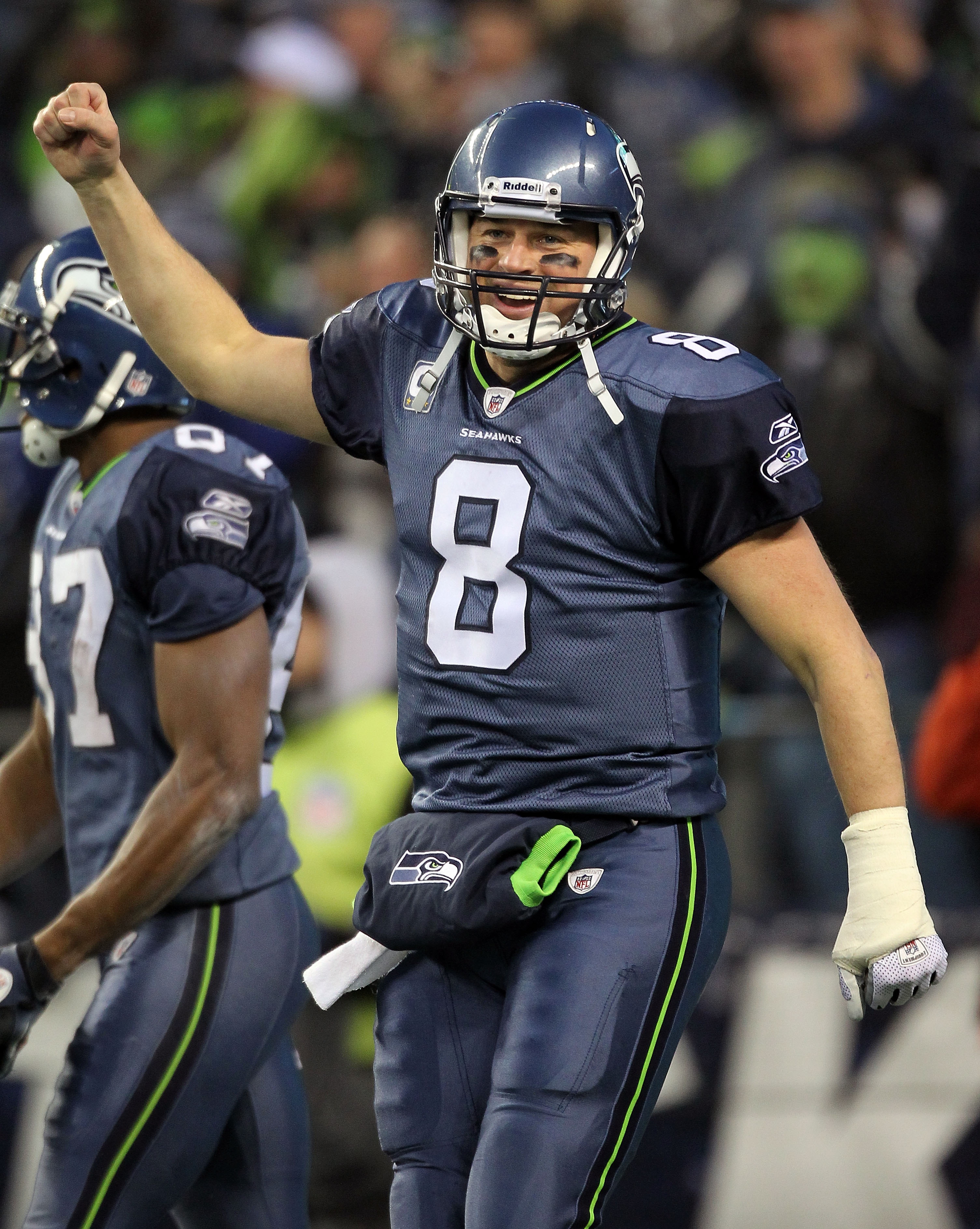 SEATTLE, WA - JANUARY 08:  Quarterback Matt Hasselbeck #8 of the Seattle Seahawks celebrates after running back Marshawn Lynch #24 scores on a 67-yard run in the fourth quarter against the New Orleans Saints during the 2011 NFC wild-card playoff game at Q