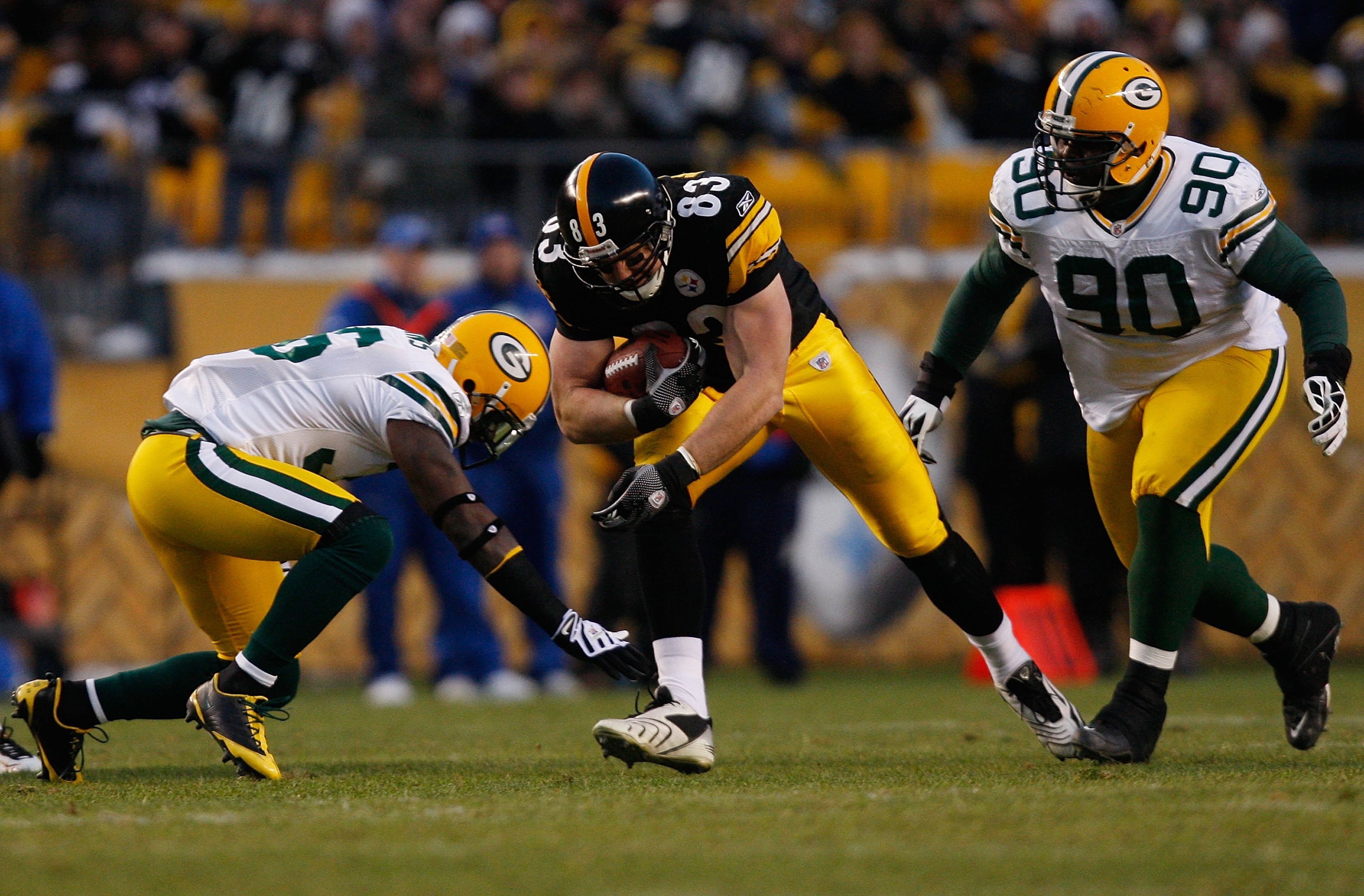 PITTSBURGH - DECEMBER 20: Heath Miller #83 of the Pittsburgh Steelers attemps to run through a tackle by BJ Raji #90 and Nick Collins #36 of the Green Bay Packers during the game on December 20, 2009 at Heinz Field in Pittsburgh, Pennsylvania. (Photo by J