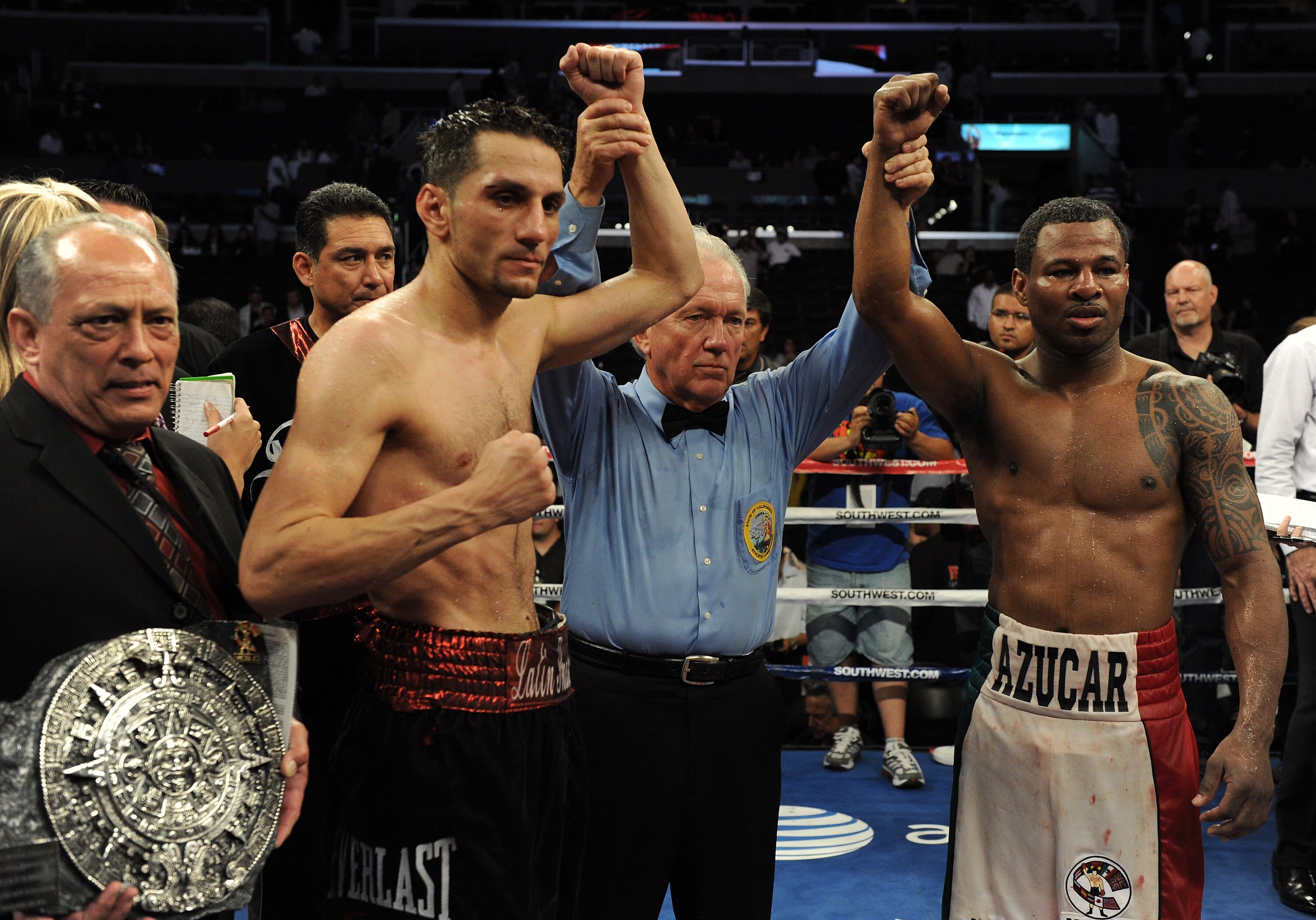LOS ANGELES, CA - SEPTEMBER 18:  Referee Pat Russell poses with Shane Mosley and Sergio Mora after the Middleweight bout at Staples Center on September 18, 2010 in Los Angeles, California.  The fight ended in a draw.  (Photo by Harry How/Getty Images)