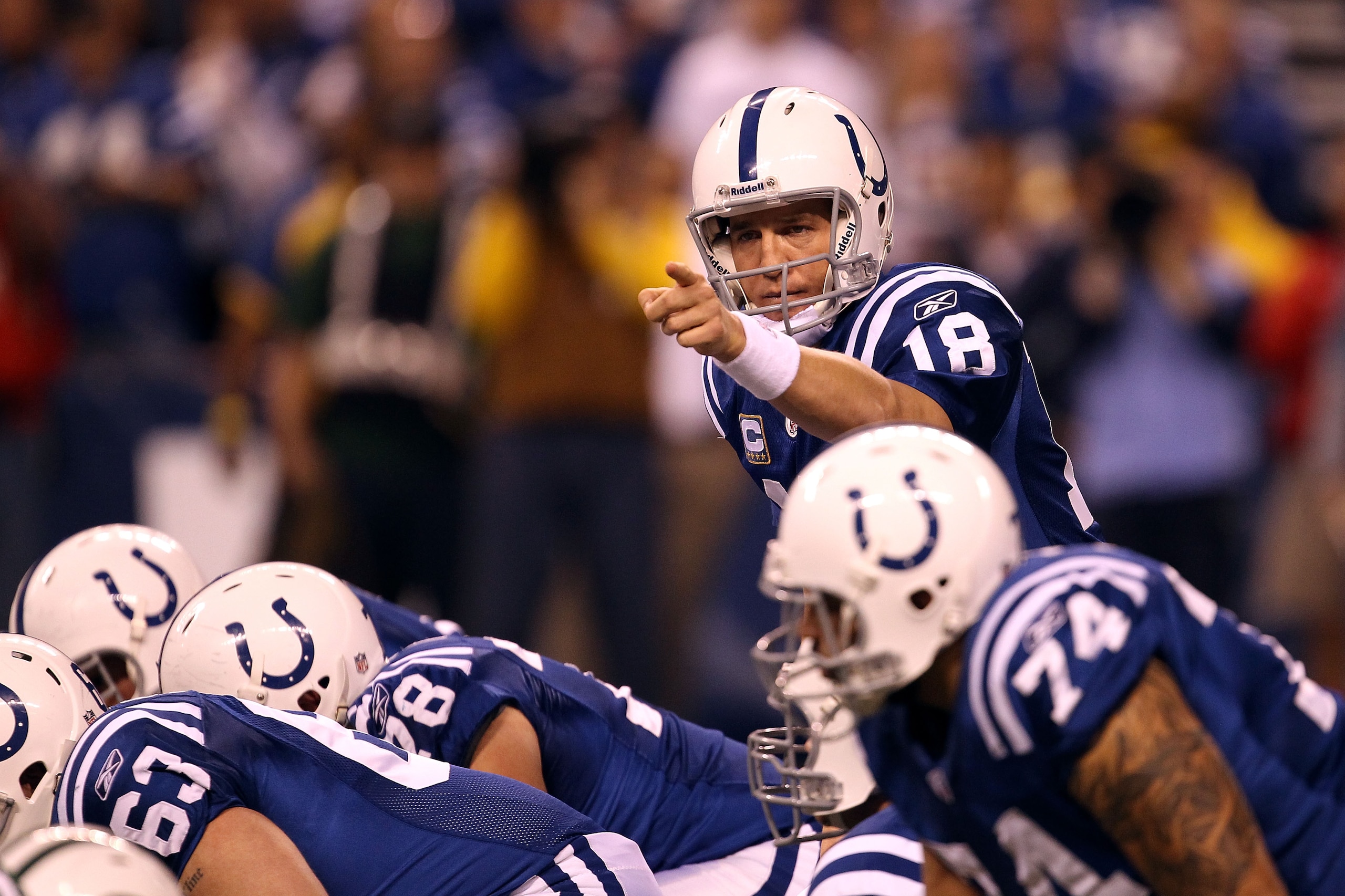 INDIANAPOLIS, IN - JANUARY 08: Peyton Manning #18 of the Indianapolis Colts gestures a she calls signals out at the line of scrimmage against the New York Jets during their 2011 AFC wild card playoff game at Lucas Oil Stadium on January 8, 2011 in Indian INDIANAPOLIS, IN - JANUARY 08: Peyton Manning #18 of the Indianapolis Colts gestures a she calls signals out at the line of scrimmage against the New York Jets during their 2011 AFC wild card playoff game at Lucas Oil Stadium on January 8, 2011 in Indian