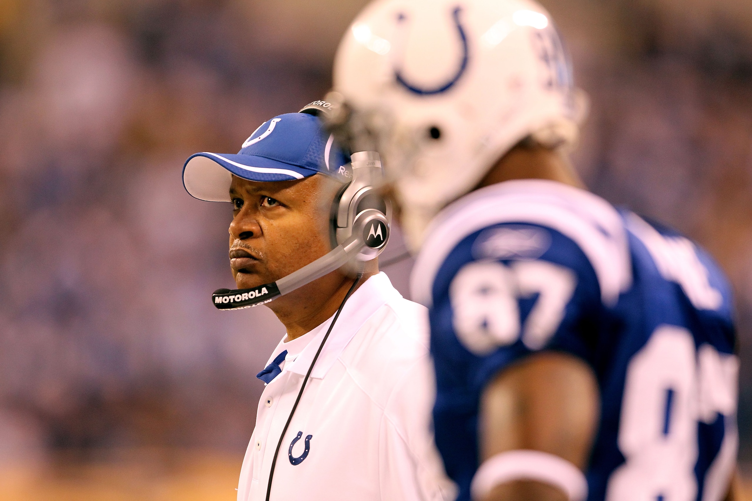 INDIANAPOLIS, IN - JANUARY 08: (L-R) Head coach Jim Caldwell and Reggie Wayne #87 of the Indianapolis Colts looks on against the New York Jets during their 2011 AFC wild card playoff game at Lucas Oil Stadium on January 8, 2011 in Indianapolis, Indiana. INDIANAPOLIS, IN - JANUARY 08: (L-R) Head coach Jim Caldwell and Reggie Wayne #87 of the Indianapolis Colts looks on against the New York Jets during their 2011 AFC wild card playoff game at Lucas Oil Stadium on January 8, 2011 in Indianapolis, Indiana.