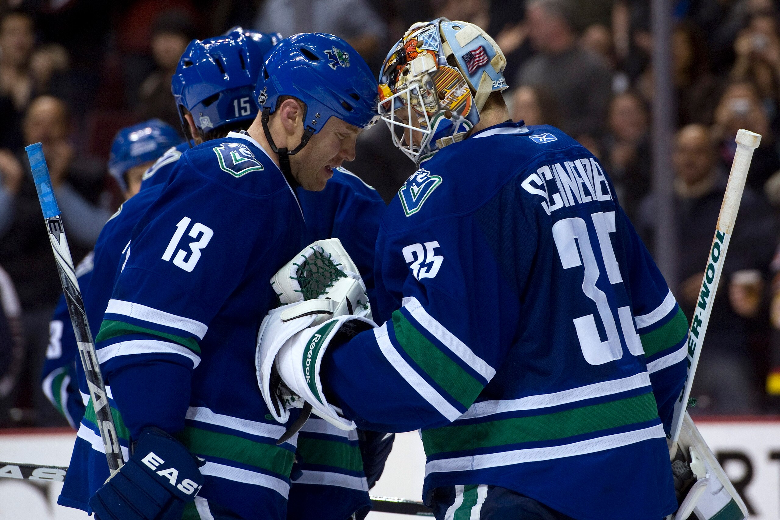 VANCOUVER, CANADA - JANUARY 7: Goalie Cory Schneider #35 of the Vancouver Canucks is congratulated by teammate Raffi Torres #13 after defeating the Edmonton Oilers at Rogers Arena January 7, 2011 in Vancouver, BC, Canada.  (Photo by Rich Lam/Getty Images)