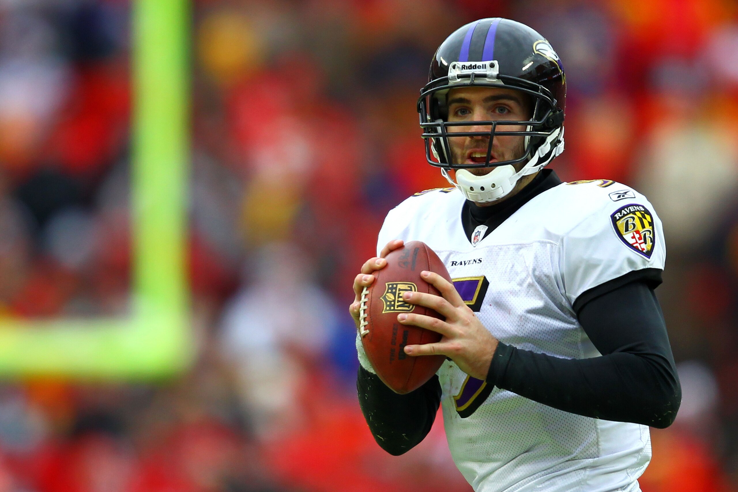 KANSAS CITY, MO - JANUARY 09:  Quarterback Joe Flacco #5 of the Baltimore Ravens looks to pass against the Kansas City Chiefs in their 2011 AFC wild card playoff game at Arrowhead Stadium on January 9, 2011 in Kansas City, Missouri.  (Photo by Dilip Vishw