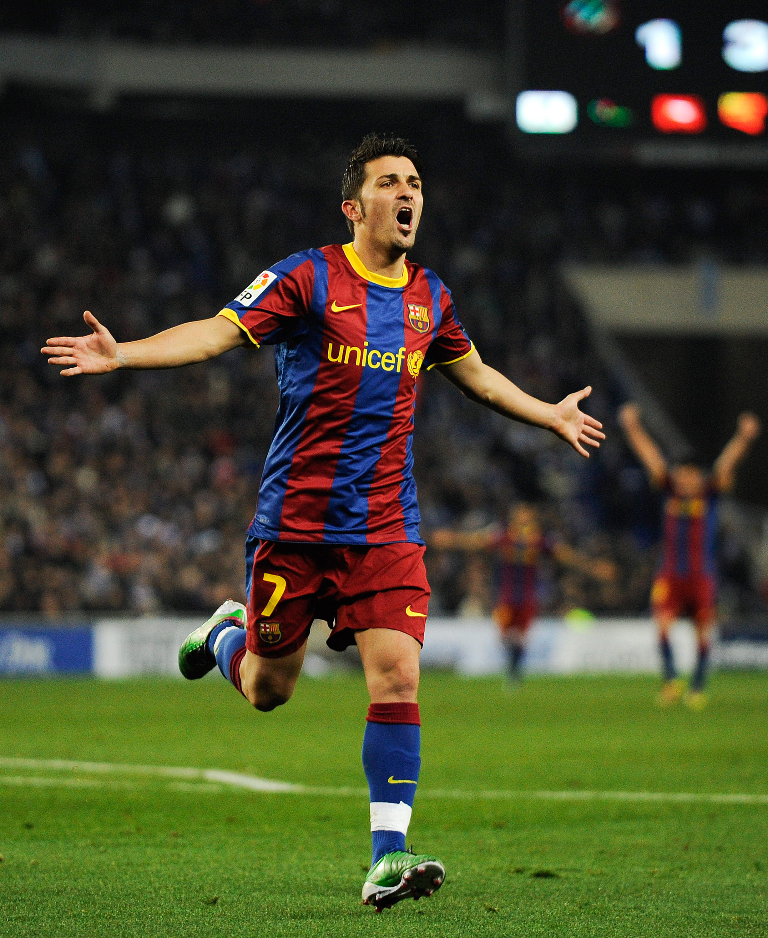BARCELONA, SPAIN - DECEMBER 18:  David Villa of Barcelona celebrates after scoring his team's fourth goal during the La Liga match between Espanyol and Barcelona at Cornella - El Prat stadium on December 18, 2010 in Barcelona, Spain. Barcelona won 1-5.  (