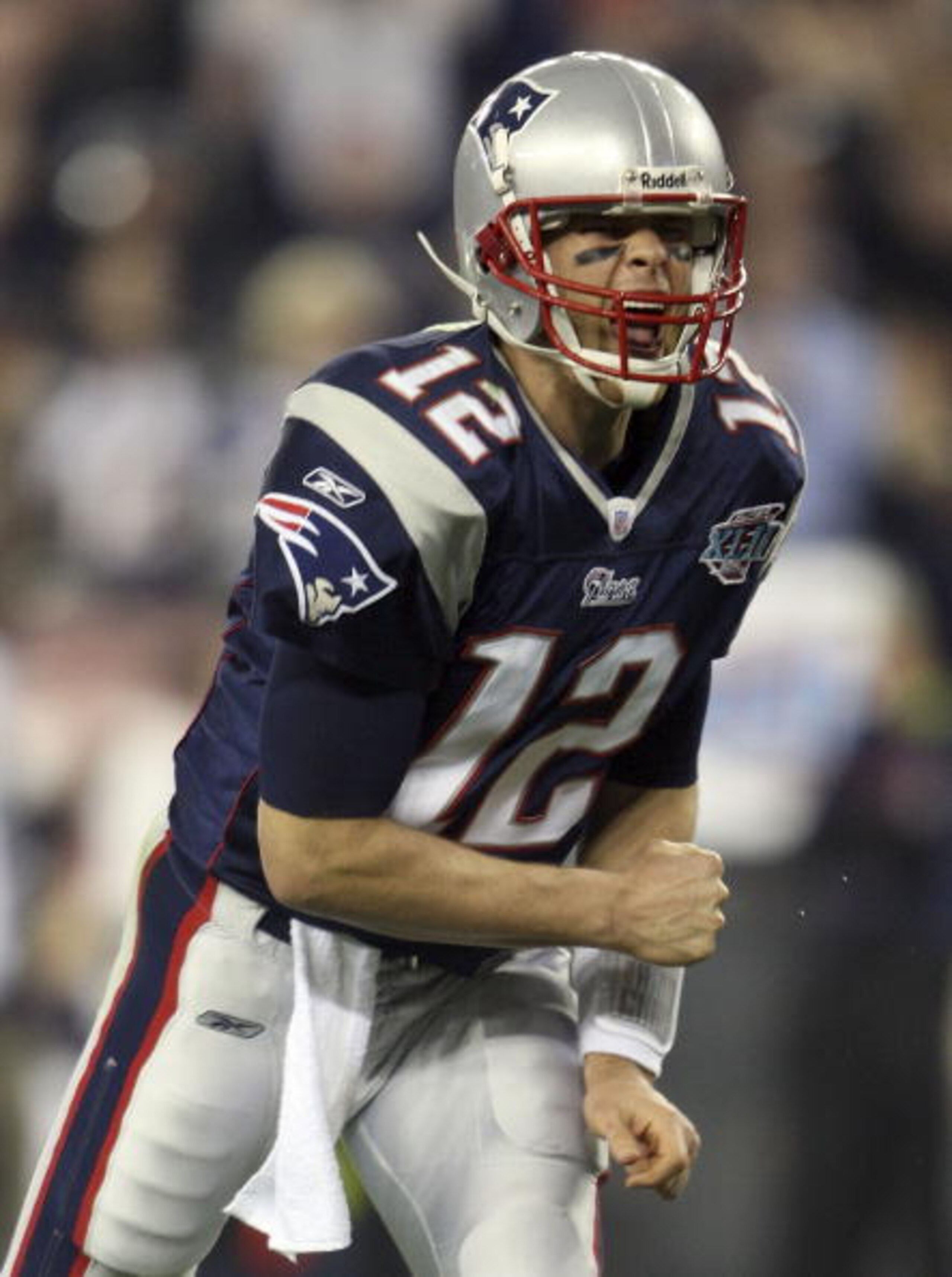 GLENDALE, AZ - FEBRUARY 03:  Quarterback Tom Brady #12 of the New England Patriots reacts after Laurence Maroney #39 scored on a 1-yard touchdown run in the second quarter against the New York Giants during Super Bowl XLII on February 3, 2008 at the Unive