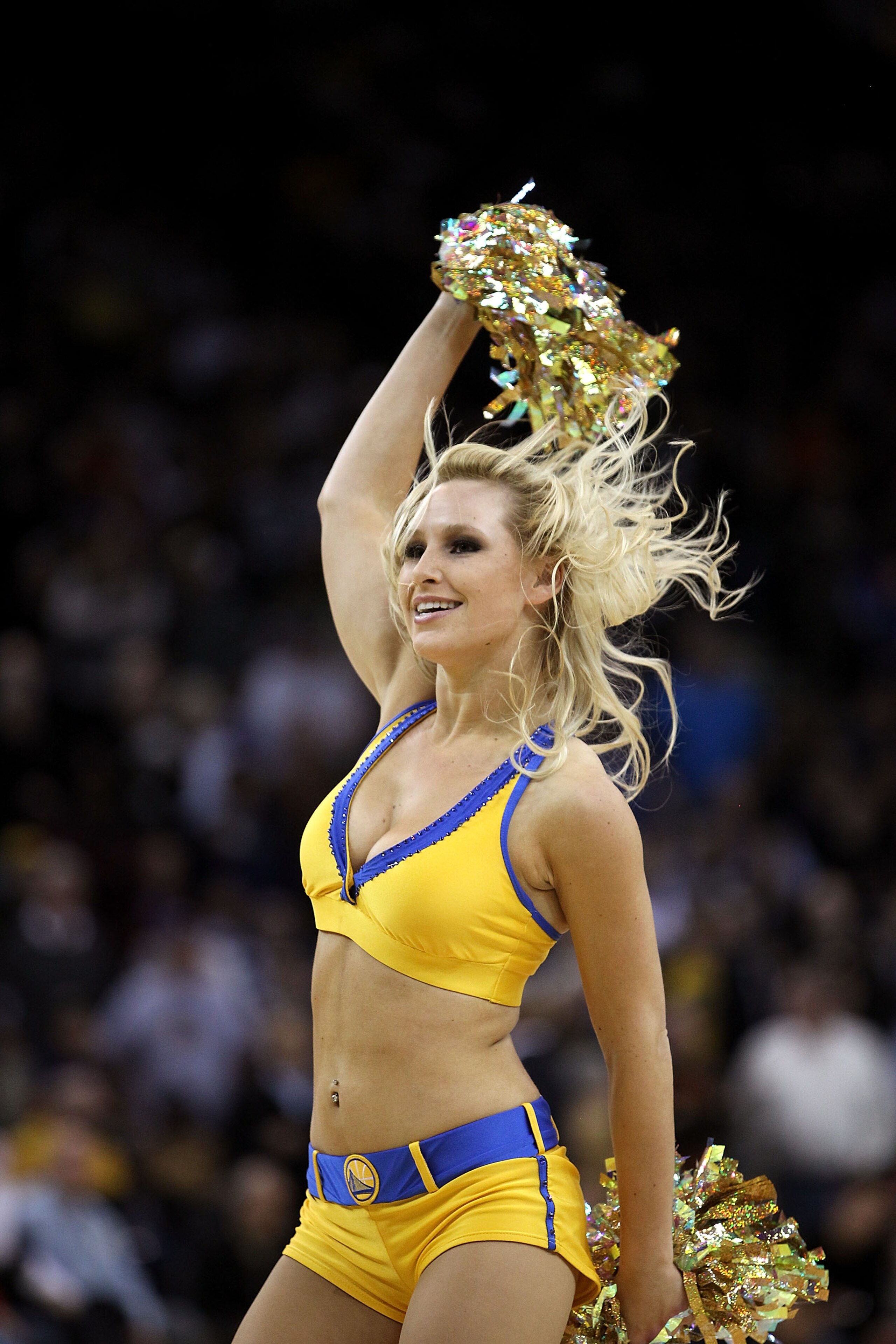 OAKLAND, CA - DECEMBER 20:  A Warrior Girl cheerleader performs during the Houston Rockets game againstthe Golden State Warriors at Oracle Arena on December 20, 2010 in Oakland, California. NOTE TO USER: User expressly acknowledges and agrees that, by dow