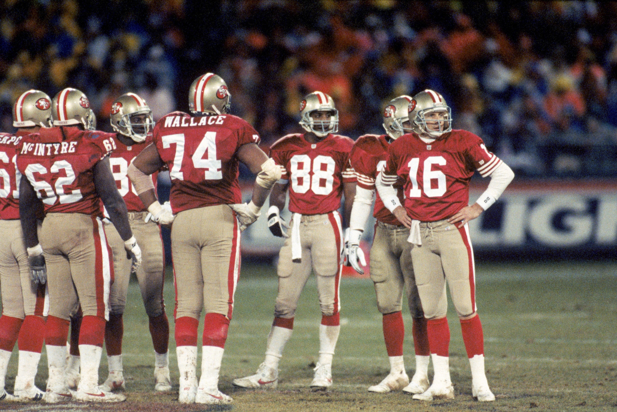 SAN FRANCISCO - DECEMBER 28:  Quarterback Joe Montana #16 of the San Francisco 49ers looks to the sidelines as he stands in the team huddle during the game against the Detroit Lions at Candlestick Park on December 28, 1992 in San Francisco, California.  T