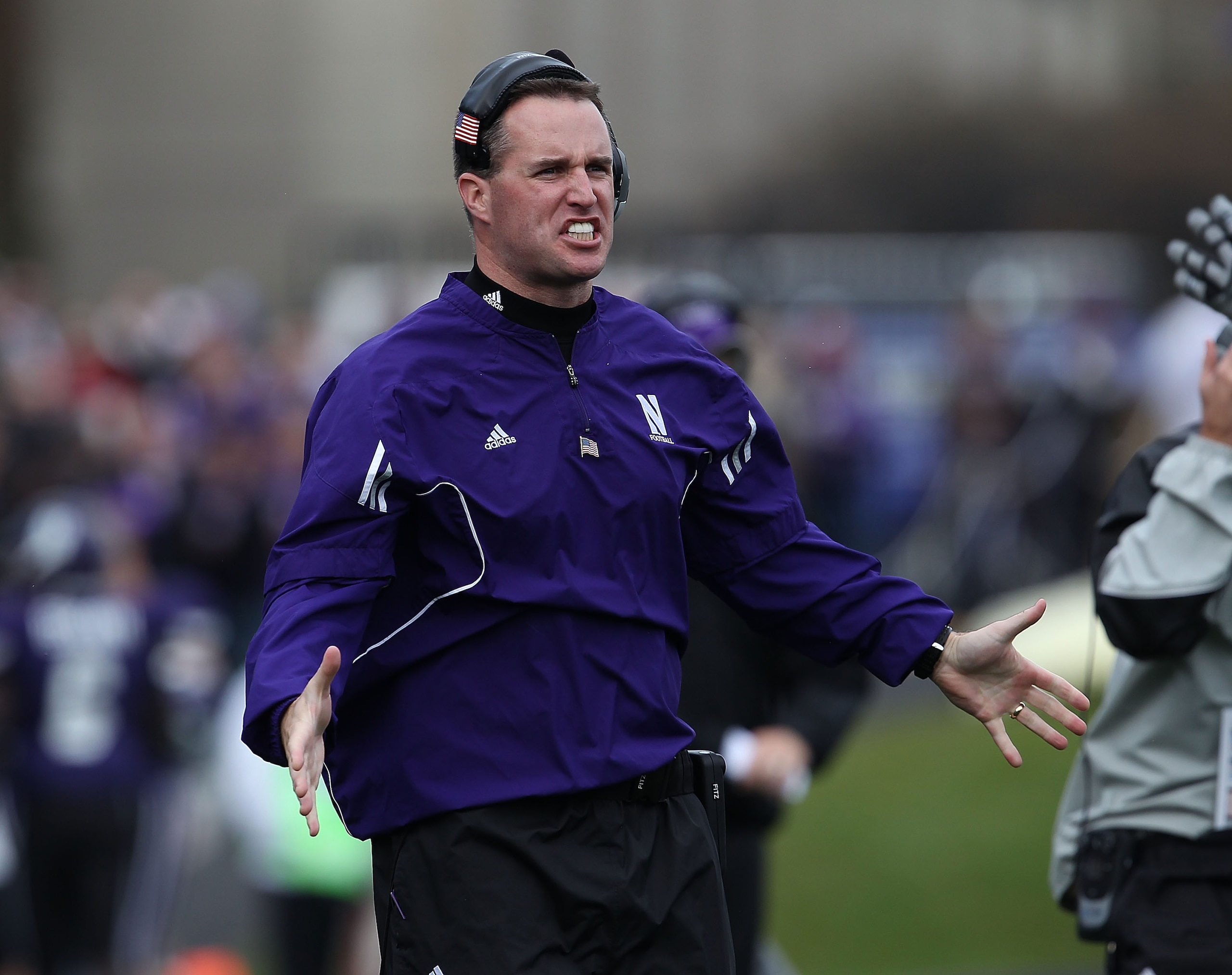 EVANSTON, IL - OCTOBER 23: Head coach Pat Fitzgerald of the Northwestern Wildcats encourages his team takes on the Michigan State Spartans at Ryan Field on October 23, 2010 in Evanston, Illinois. Michigan State defeated Northwestern 35-27.  (Photo by Jona