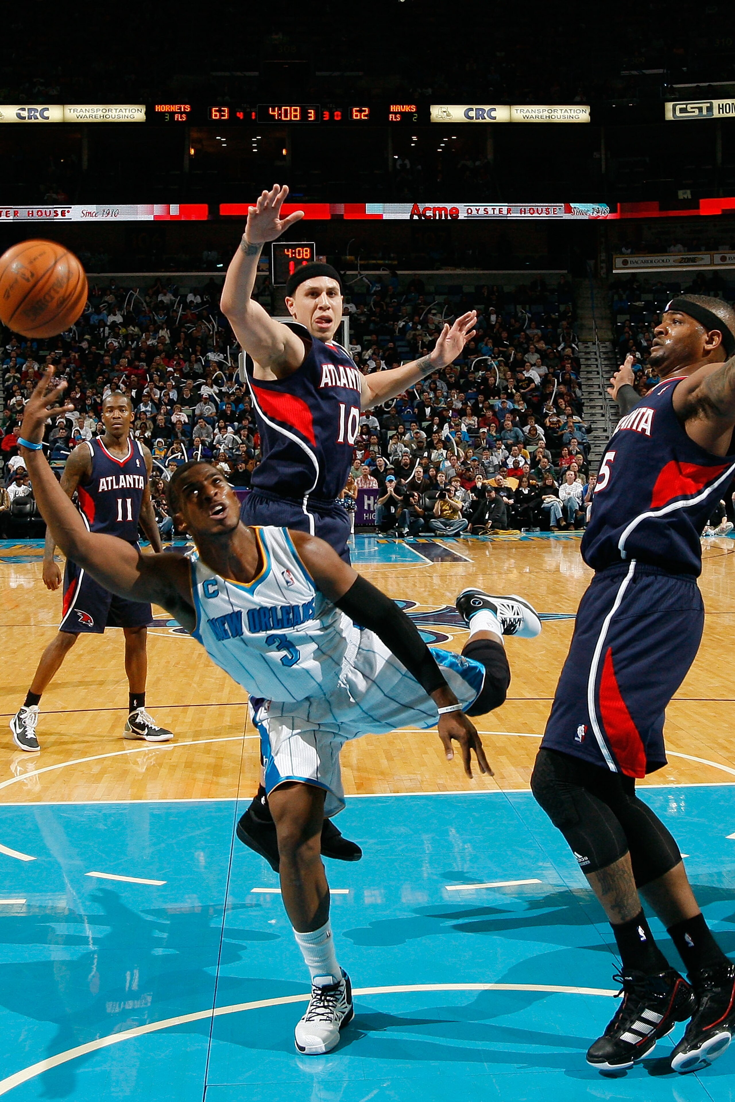 NEW ORLEANS, LA - DECEMBER 26:  Chris Paul #3 of the New Orleans Hornets shoots the ball over Josh Smith #5 of the Atlanta Hawks at the New Orleans Arena on December 26, 2010 in New Orleans, Louisiana.  The Hornets defeated the Hawks 93-86.  NOTE TO USER: