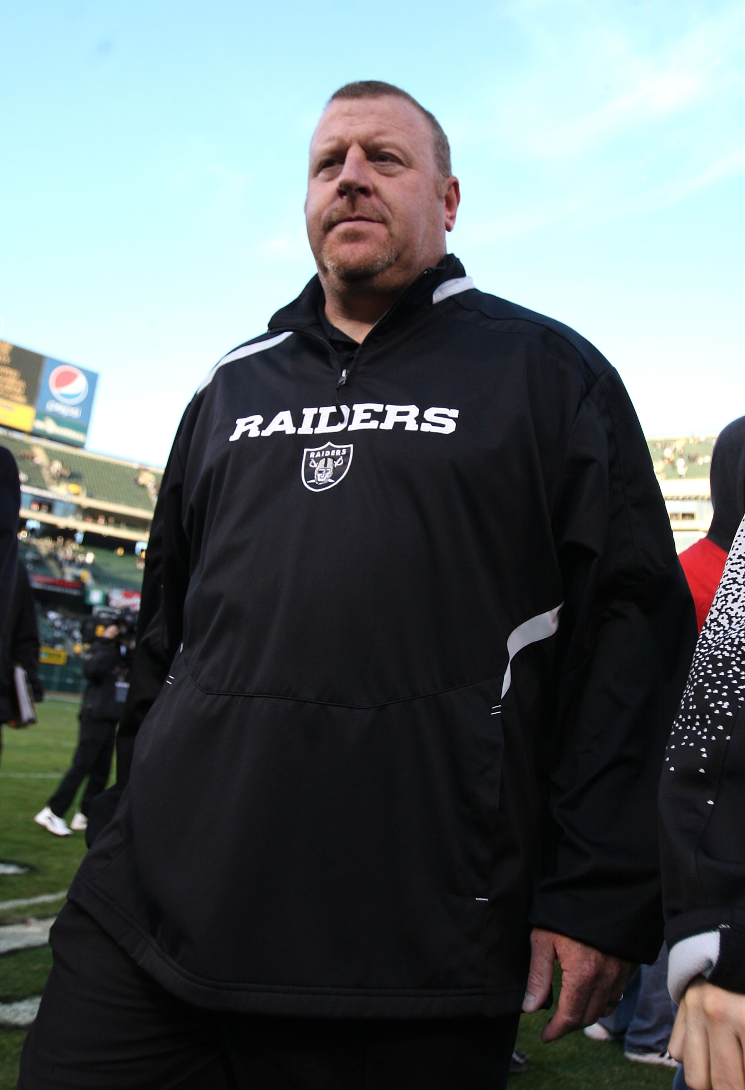 OAKLAND, CA - JANUARY 03: Head coach Tom Cable of the Oakland Raiders walks off the field after losing to the Baltimore Ravens during an NFL game at Oakland-Alameda County Coliseum on January 3, 2010 in Oakland, California.  (Photo by Jed Jacobsohn/Getty