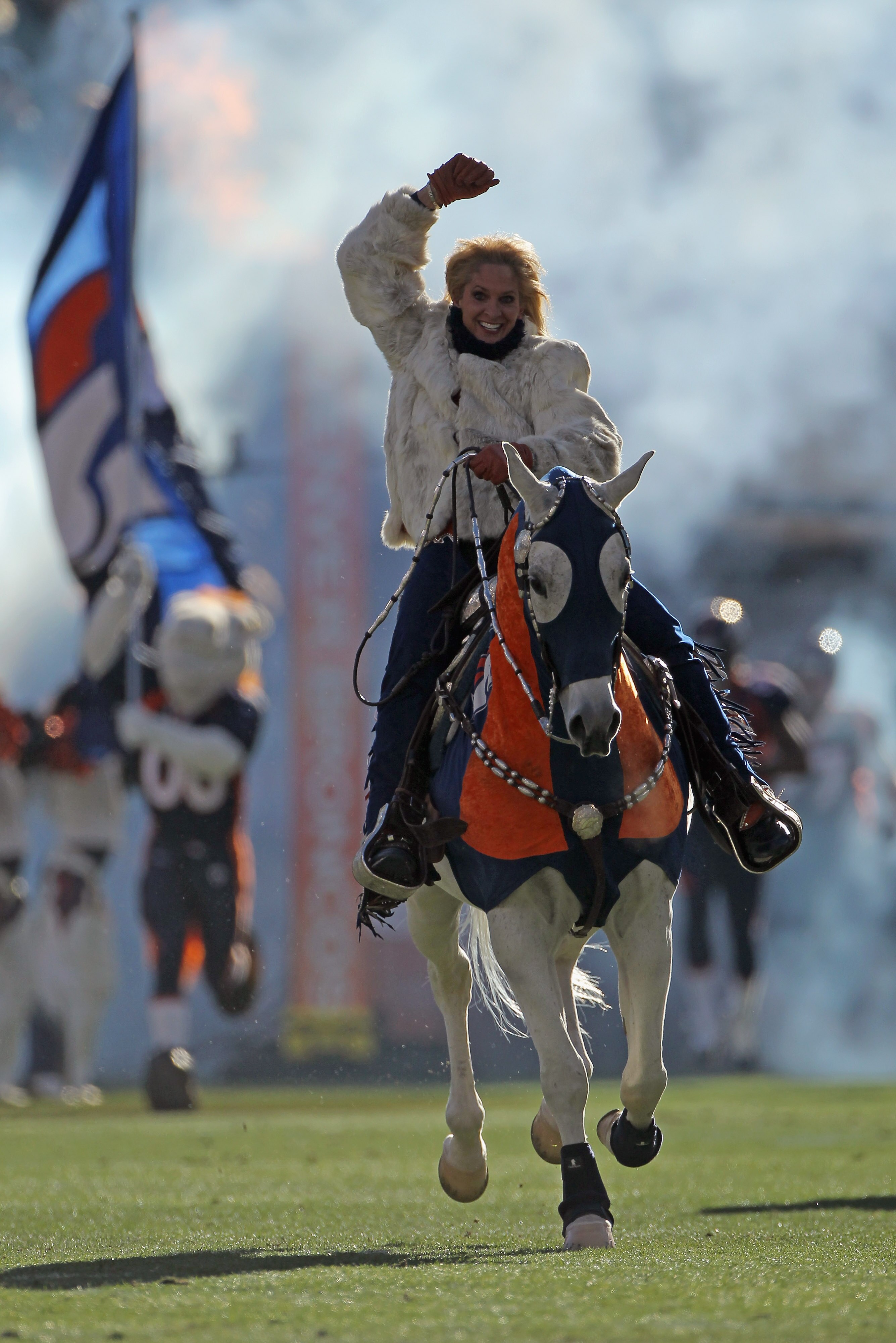 DENVER - JANUARY 02:  Ann Judge-Wegener rides Thunder onto the field as the Denver Broncos prepare to face the San Diego Chargers at INVESCO Field at Mile High on January 2, 2011 in Denver, Colorado. The Chargers defeated the Broncos 33-28.  (Photo by Dou