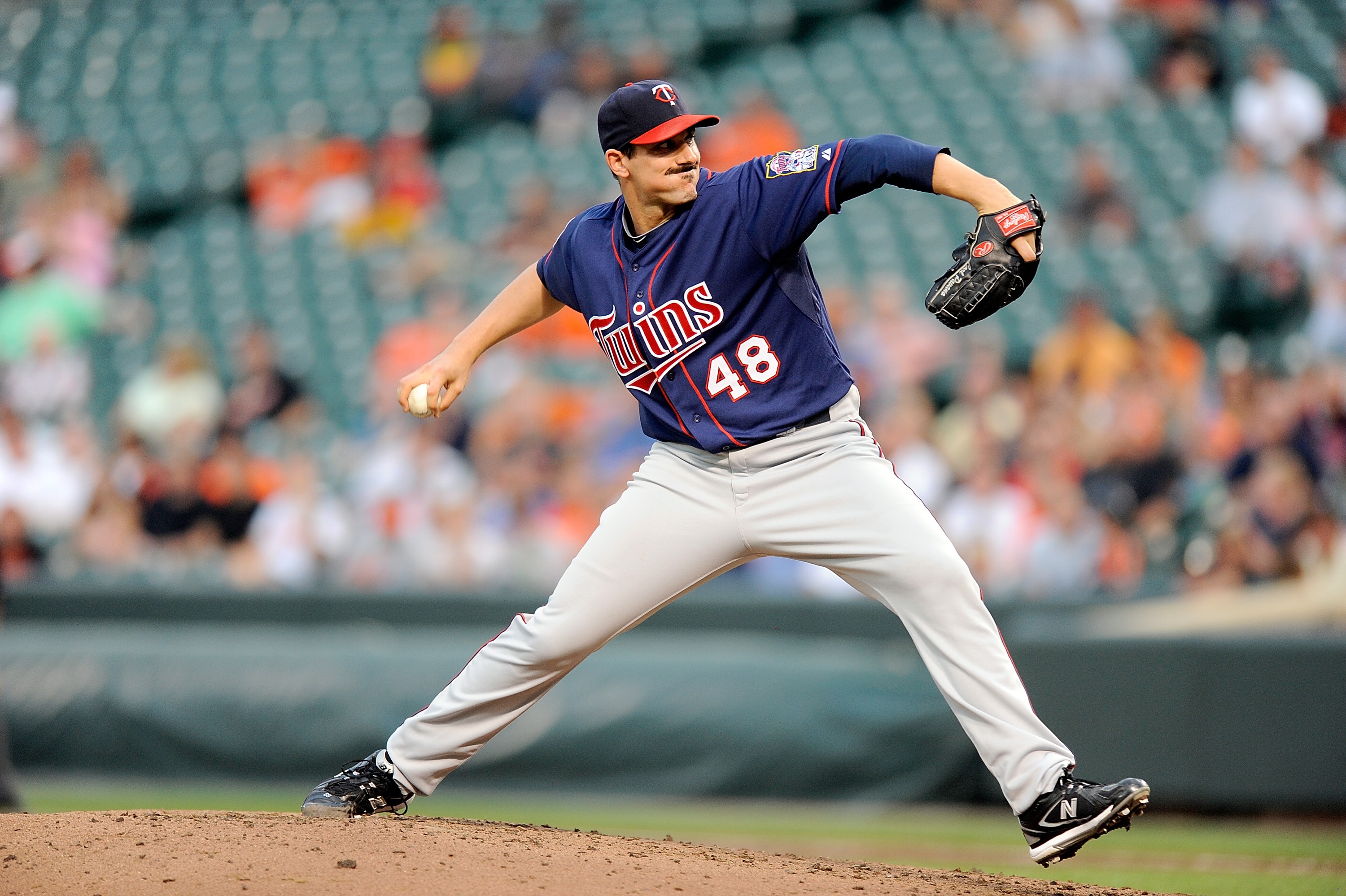 BALTIMORE - JULY 22:  Carl Pavano #48 of the Minnesota Twins pitches against the Baltimore Orioles at Camden Yards on July 22, 2010 in Baltimore, Maryland.  (Photo by Greg Fiume/Getty Images)