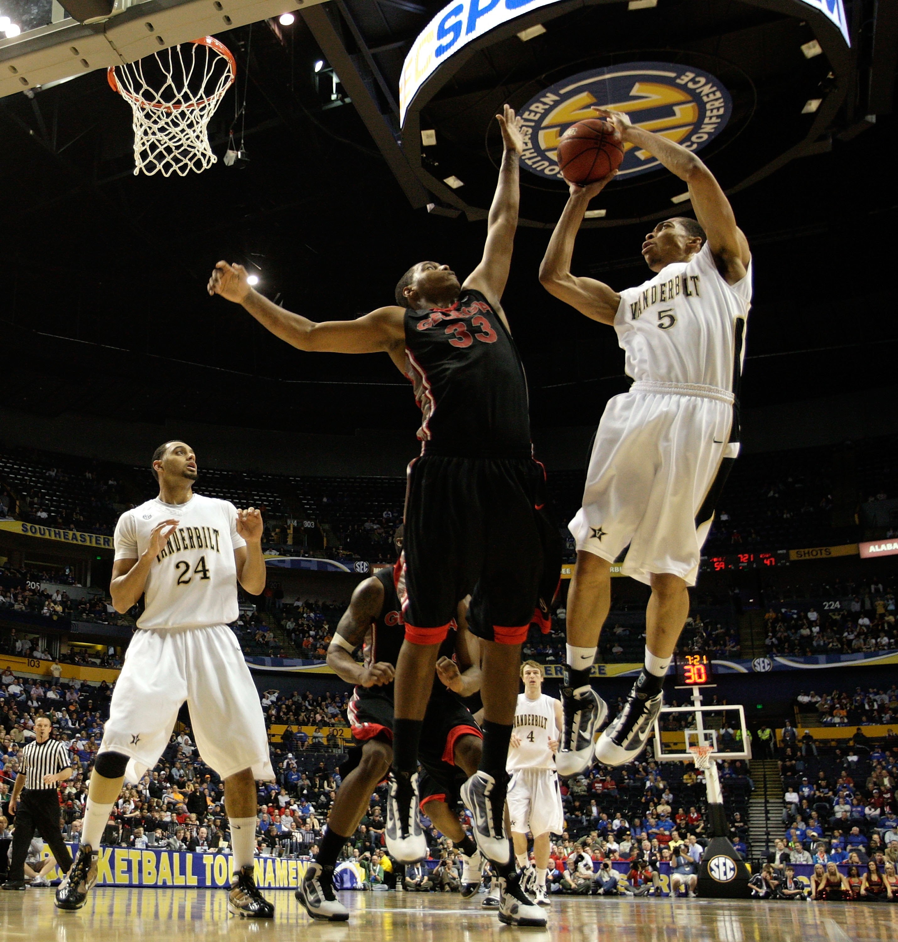 NASHVILLE, TN - MARCH 12:  Lance Goulbourne #5 of the Vanderbilt Commodores attempts a shot against Trey Thompkins #33 of the Georgia Bulldogs during the quarterfinals of the SEC Men's Basketball Tournament at the Bridgestone Arena on March 12, 2010 in Na
