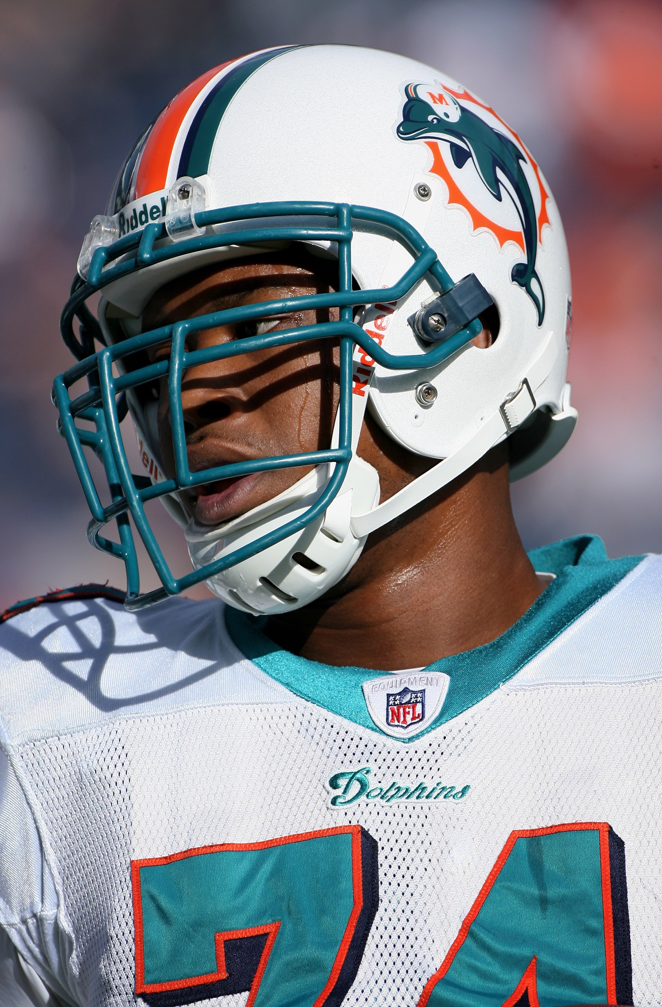 DENVER - NOVEMBER 02:  Linbacker Quentin Moses #74 of the Miami Dolphins warms up prior to facing the Denver Broncos during NFL action at Invesco Field at Mile High on November 2, 2008 in Denver, Colorado. The Dolphins defeated the Broncos 26-17.  (Photo