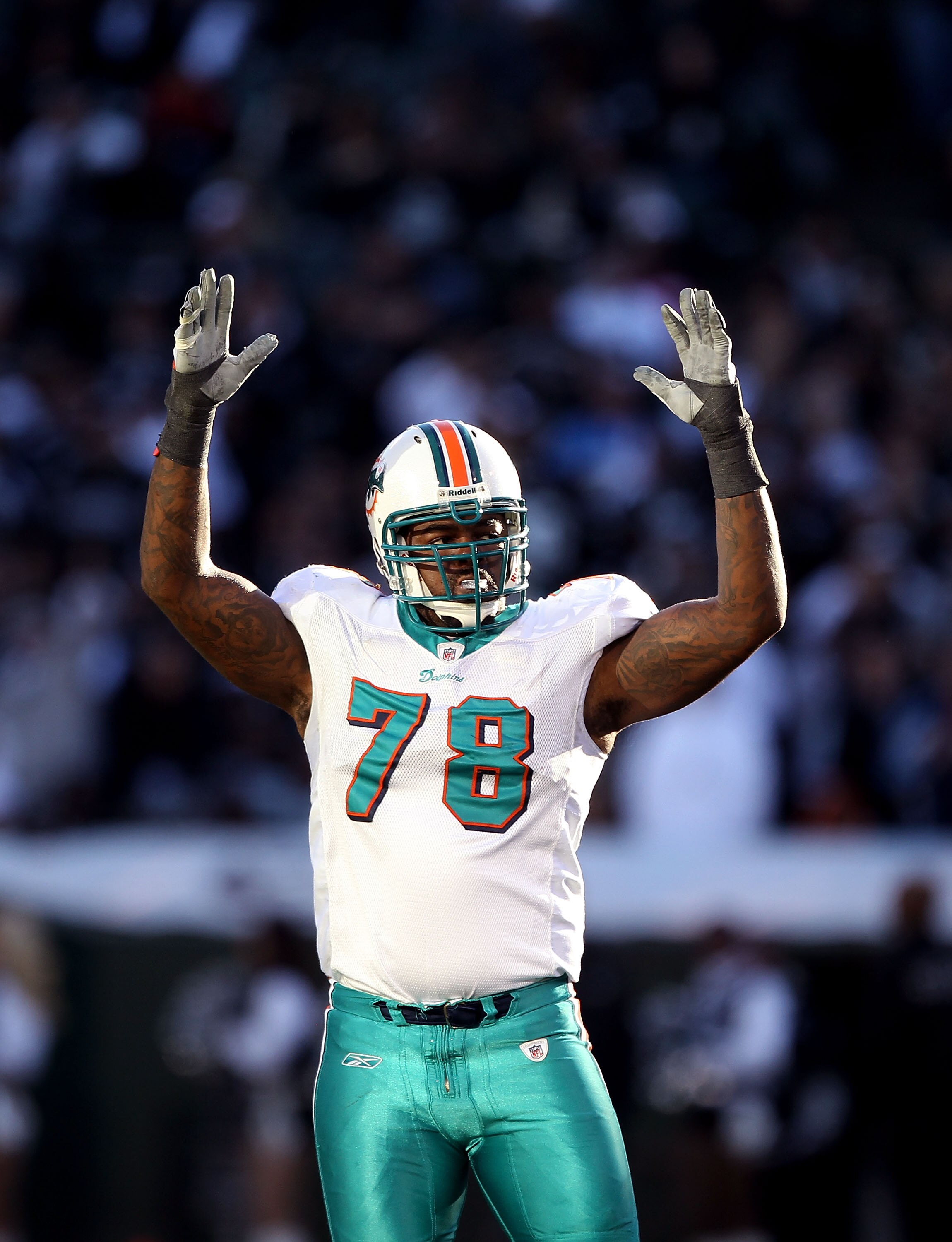 OAKLAND, CA - NOVEMBER 28:  Tony McDaniel #78 of the Miami Dolphins celebrates after the Dolphins kicked a field goal against the Oakland Raiders at Oakland-Alameda County Coliseum on November 28, 2010 in Oakland, California.  (Photo by Ezra Shaw/Getty Im