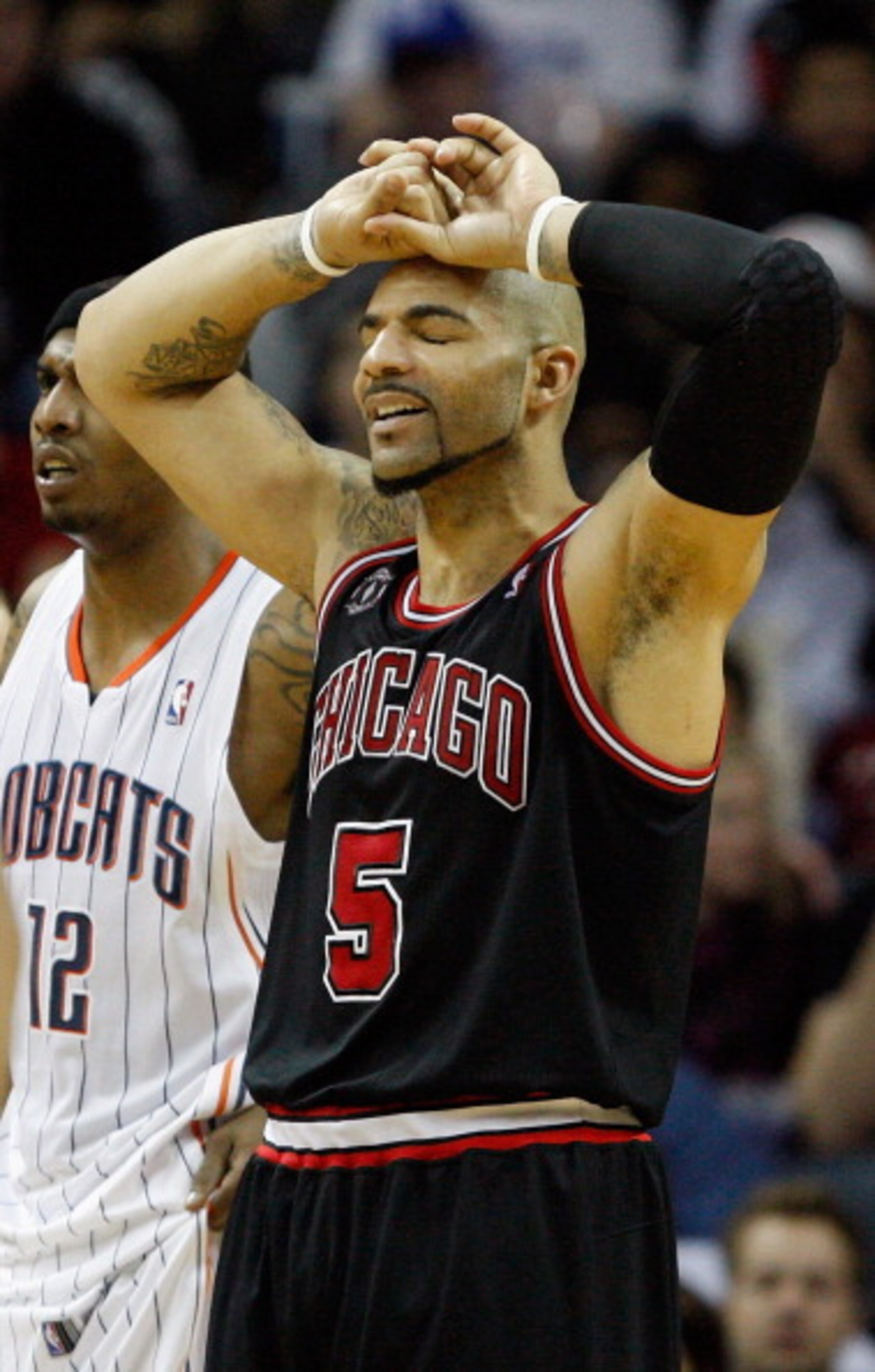 CHARLOTTE, NC - JANUARY 12:  Carlos Boozer #5 of the Chicago Bulls reacts to a play against the Charlotte Bobcats during their game at Time Warner Cable Arena on January 12, 2011 in Charlotte, North Carolina. NOTE TO USER: User expressly acknowledges and 