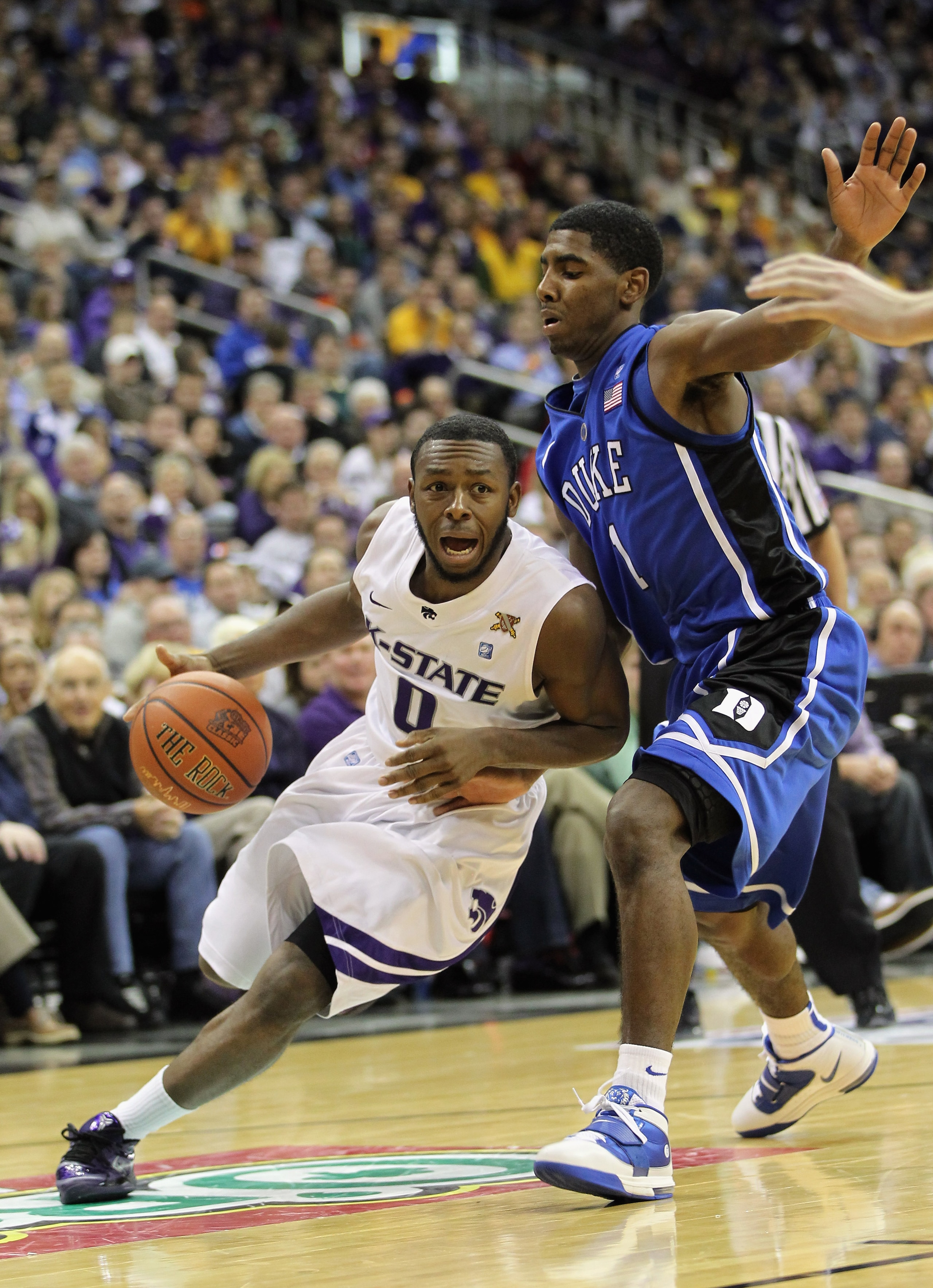KANSAS CITY, MO - NOVEMBER 23: Jacob Pullen #0 of the Kansas State Wildcats drives as Kyrie Irving #1 of the Duke Blue Devils defends during the CBE Classic championship game on November 23, 2010 at the Sprint Center in Kansas City, Missouri. (Photo by KANSAS CITY, MO - NOVEMBER 23: Jacob Pullen #0 of the Kansas State Wildcats drives as Kyrie Irving #1 of the Duke Blue Devils defends during the CBE Classic championship game on November 23, 2010 at the Sprint Center in Kansas City, Missouri. (Photo by