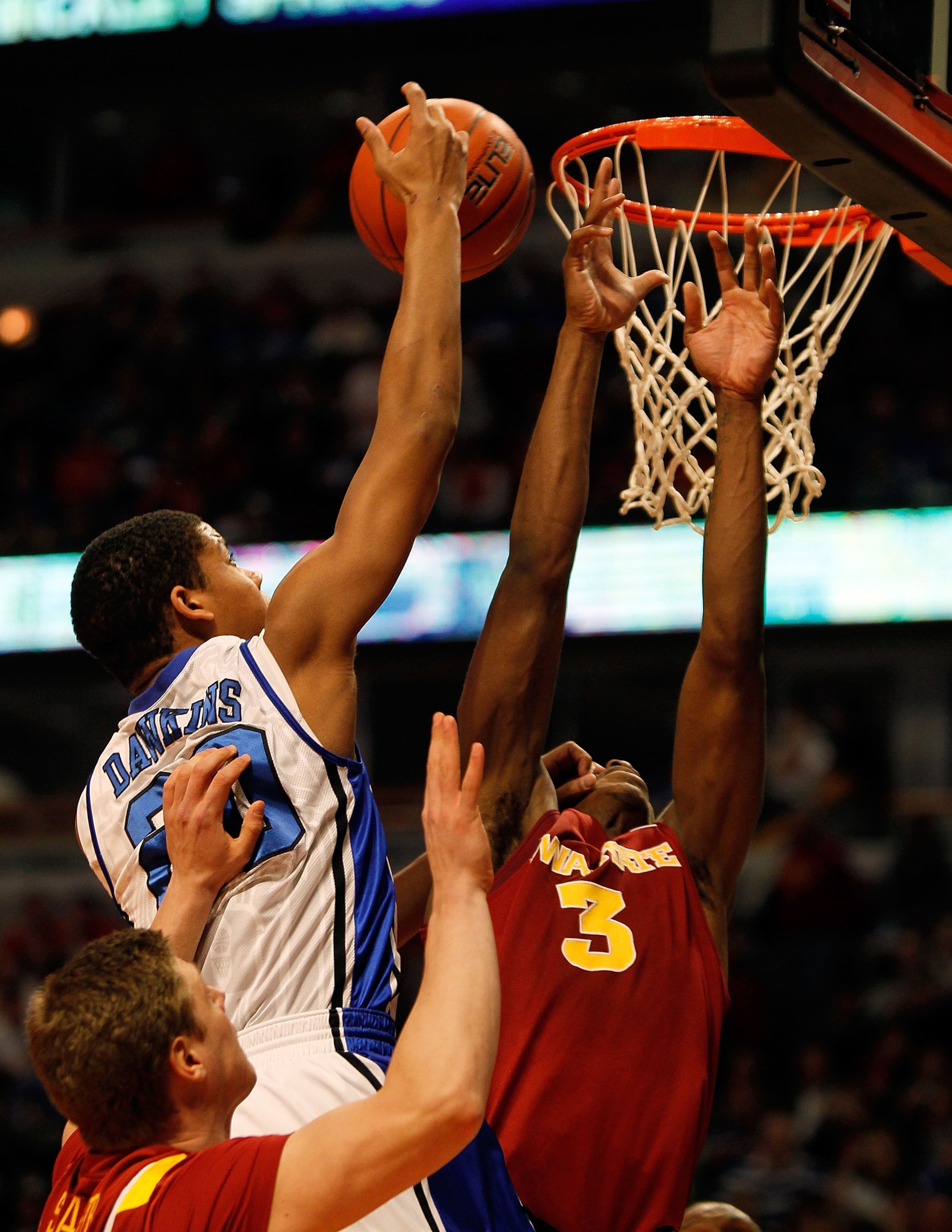 CHICAGO - JANUARY 06: Andre Dawkins #20 of the Duke Blue Devils puts up a shot against Marquis Gilstrap #3 of the Iowa State Cyclones at the United Center on January 6, 2010 in Chicago, Illinois. Duke defeated Iowa State 86-65. (Photo by Jonathan Daniel/G