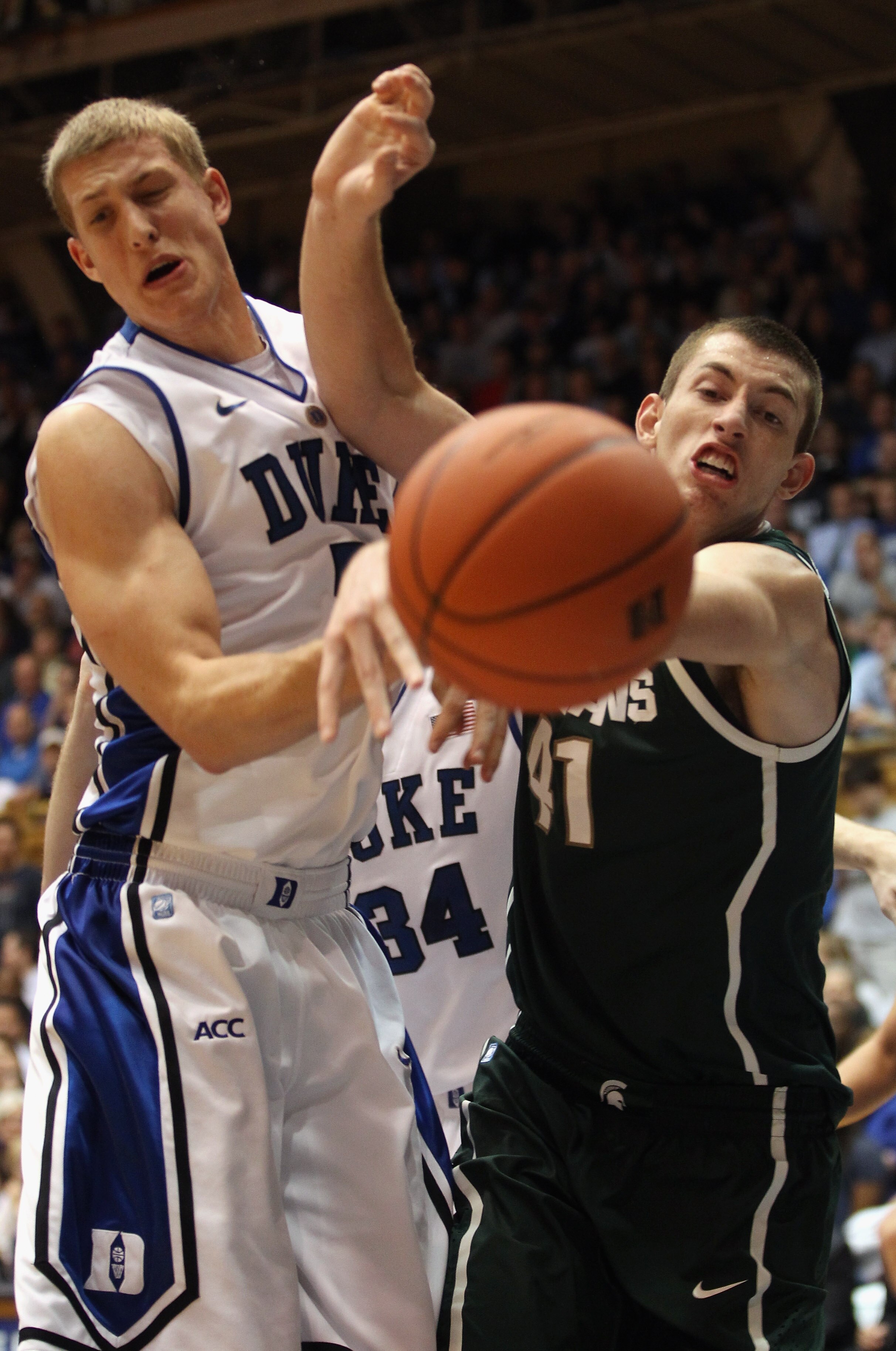 DURHAM, NC - DECEMBER 01:  Garrick Sherman #41 of the Michigan State Spartans battles for a loose ball with Mason Plumlee #5 of the Duke Blue Devils during their game at Cameron Indoor Stadium on December 1, 2010 in Durham, North Carolina.  (Photo by Stre