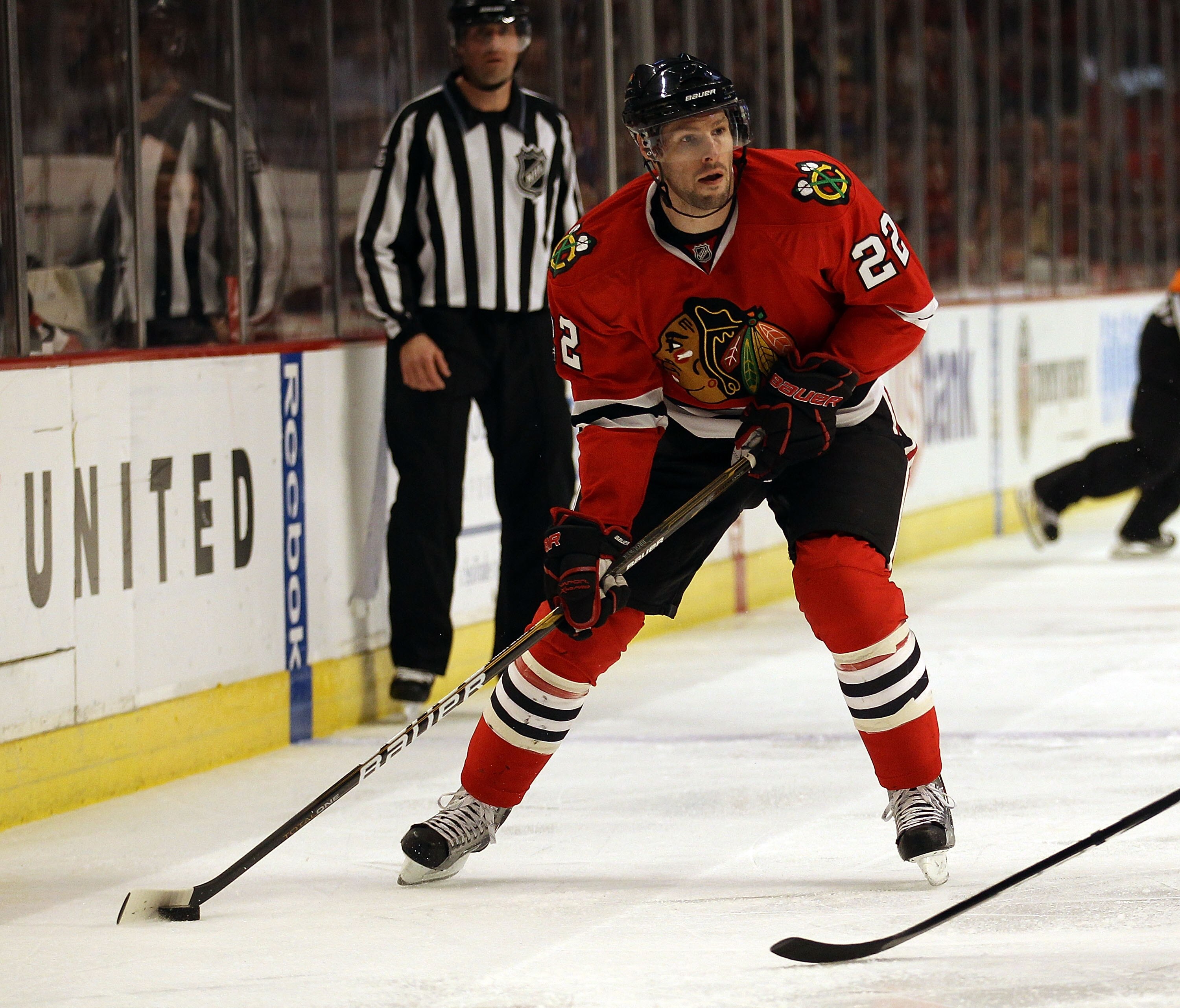 CHICAGO, IL - DECEMBER 17: Troy Brouwer #22 of the Chicago Blackhawks looks to pass against the Detroit Red Wings at the United Center on December 17, 2010 in Chicago, Illinois. The Blackhawks defeated the Red Wings 4-1. (Photo by Jonathan Daniel/Getty Im