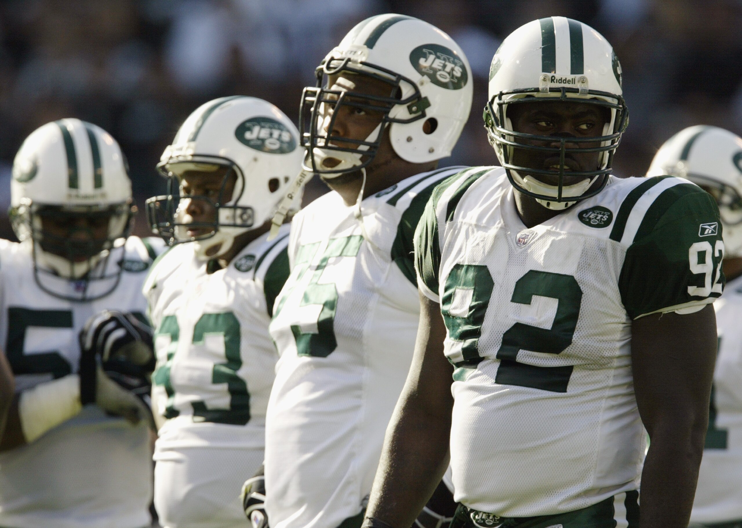 OAKLAND, CA - NOVEMBER 9:  Defensive end Shaun Ellis #92 (front) of the New York Jets is on the field with the rest of his teammates during the game against the Oakland Raiders on November 9, 2003  at the Network Associates Coliseum in Oakland, California