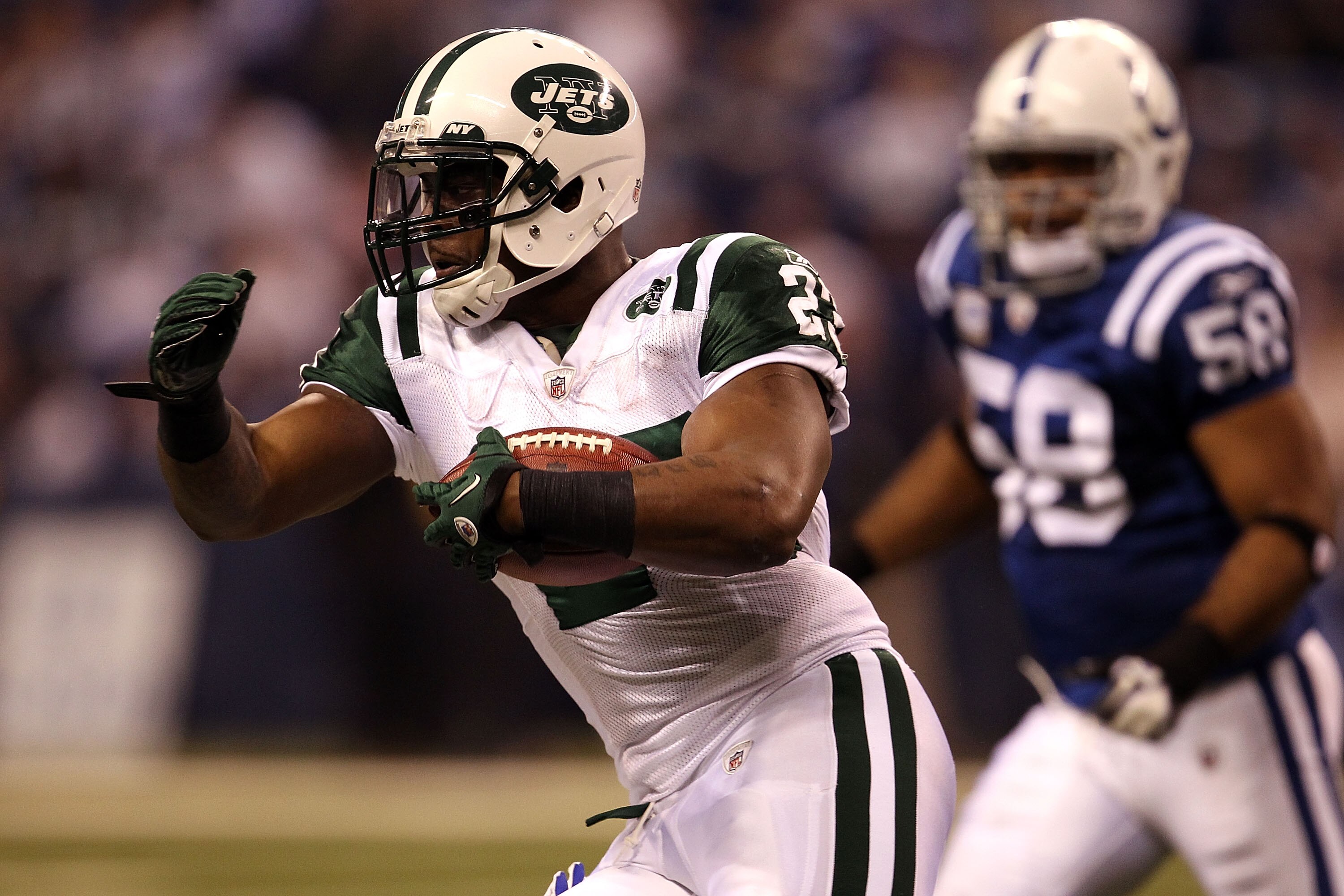 INDIANAPOLIS, IN - JANUARY 08:  Shonn Greene #23 of the New York Jets runs the ball against the Indianapolis Colts during their 2011 AFC wild card playoff game at Lucas Oil Stadium on January 8, 2011 in Indianapolis, Indiana. The Jets won 17-16.  (Photo b