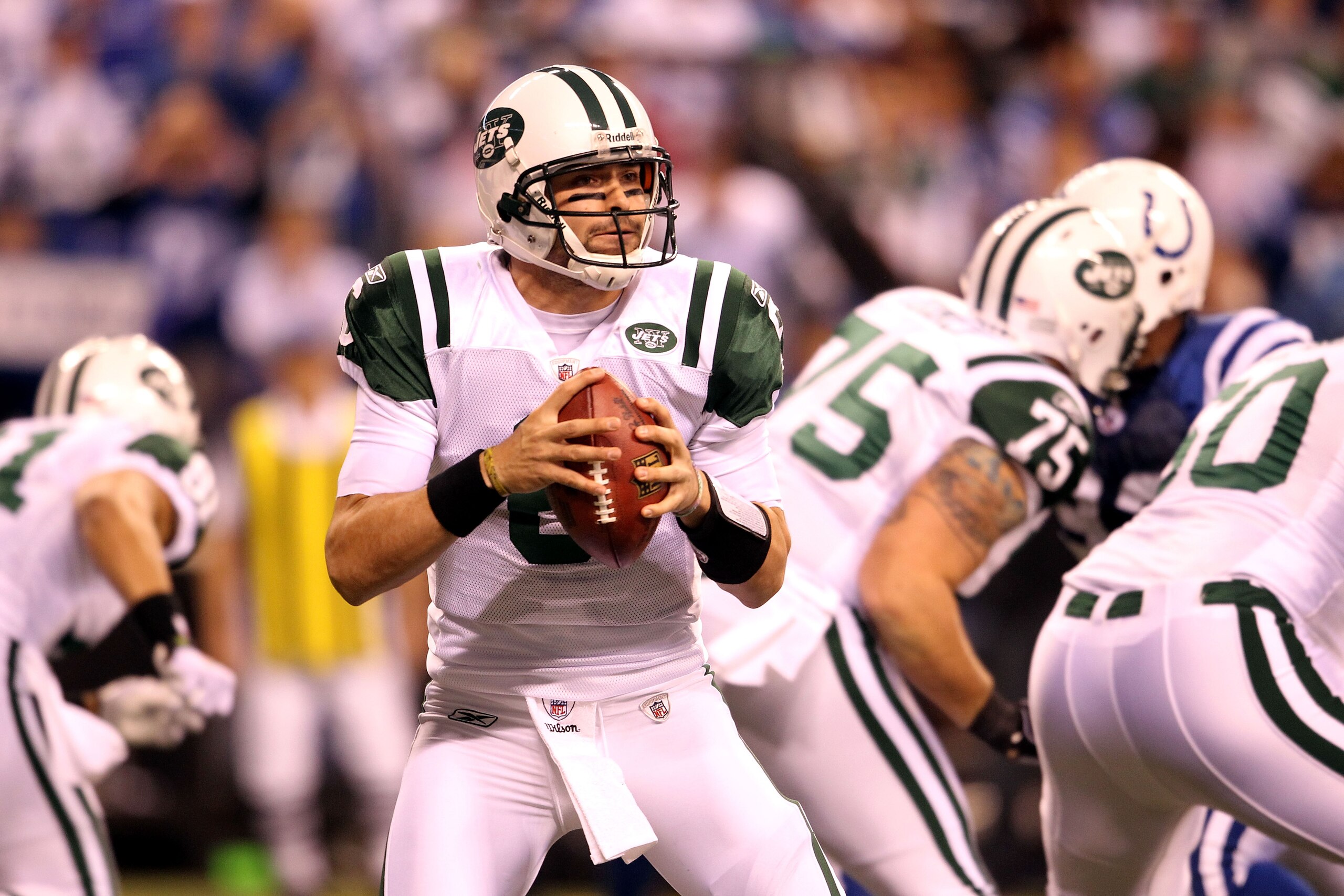 INDIANAPOLIS, IN - JANUARY 08:  Mark Sanchez #6 of the New York Jets drops back to pass against the Indianapolis Colts during their 2011 AFC wild card playoff game at Lucas Oil Stadium on January 8, 2011 in Indianapolis, Indiana. The Jets won 17-16.  (Pho