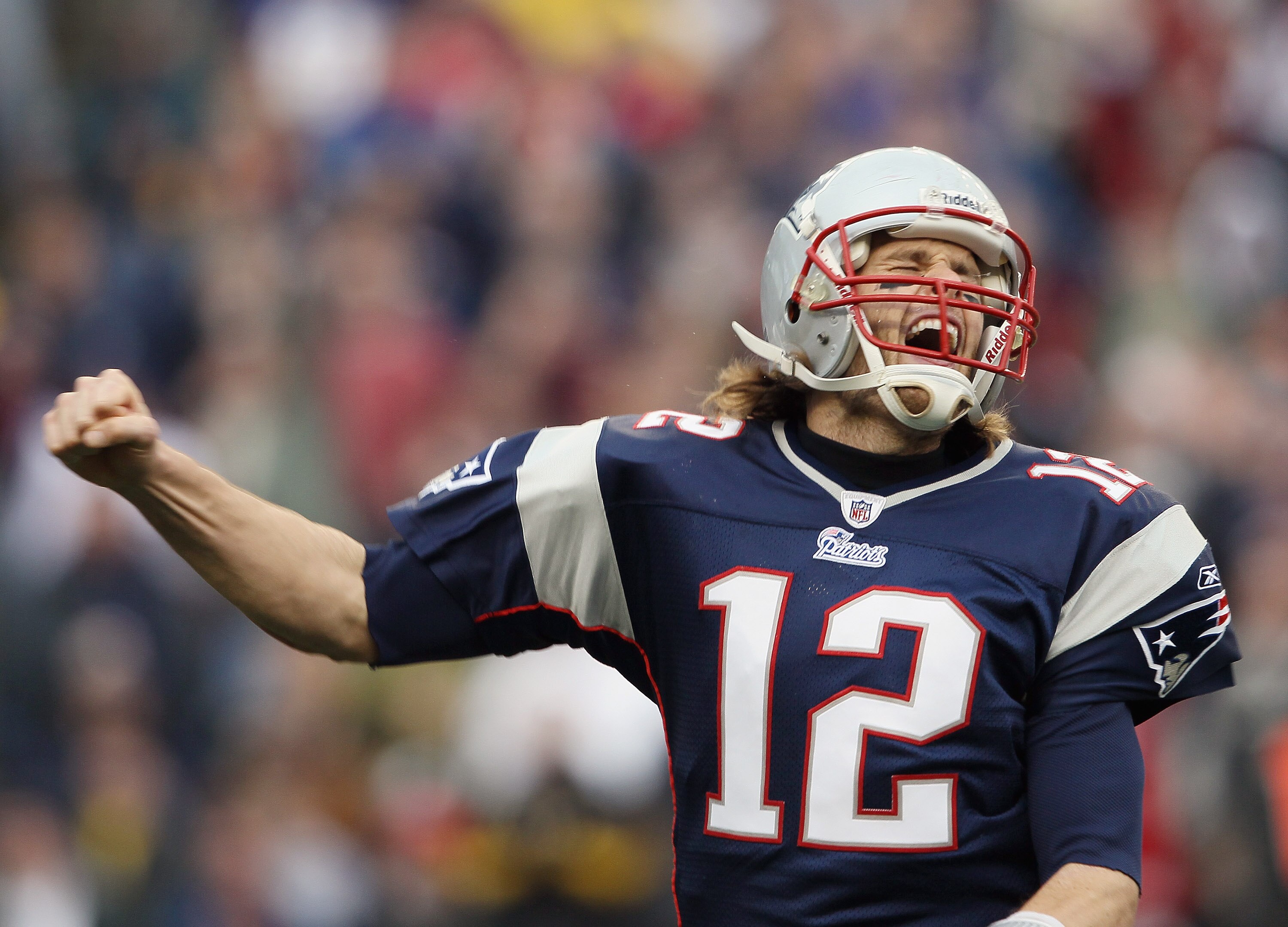 FOXBORO, MA - JANUARY 02:  Tom Brady #12 of the New England Patriots celebrates a touchdown by teammate BenJarvis Green-Ellis in the first quarter against the Miami Dolphins on January 2, 2011 at Gillette Stadium in Foxboro, Massachusetts.  (Photo by Elsa