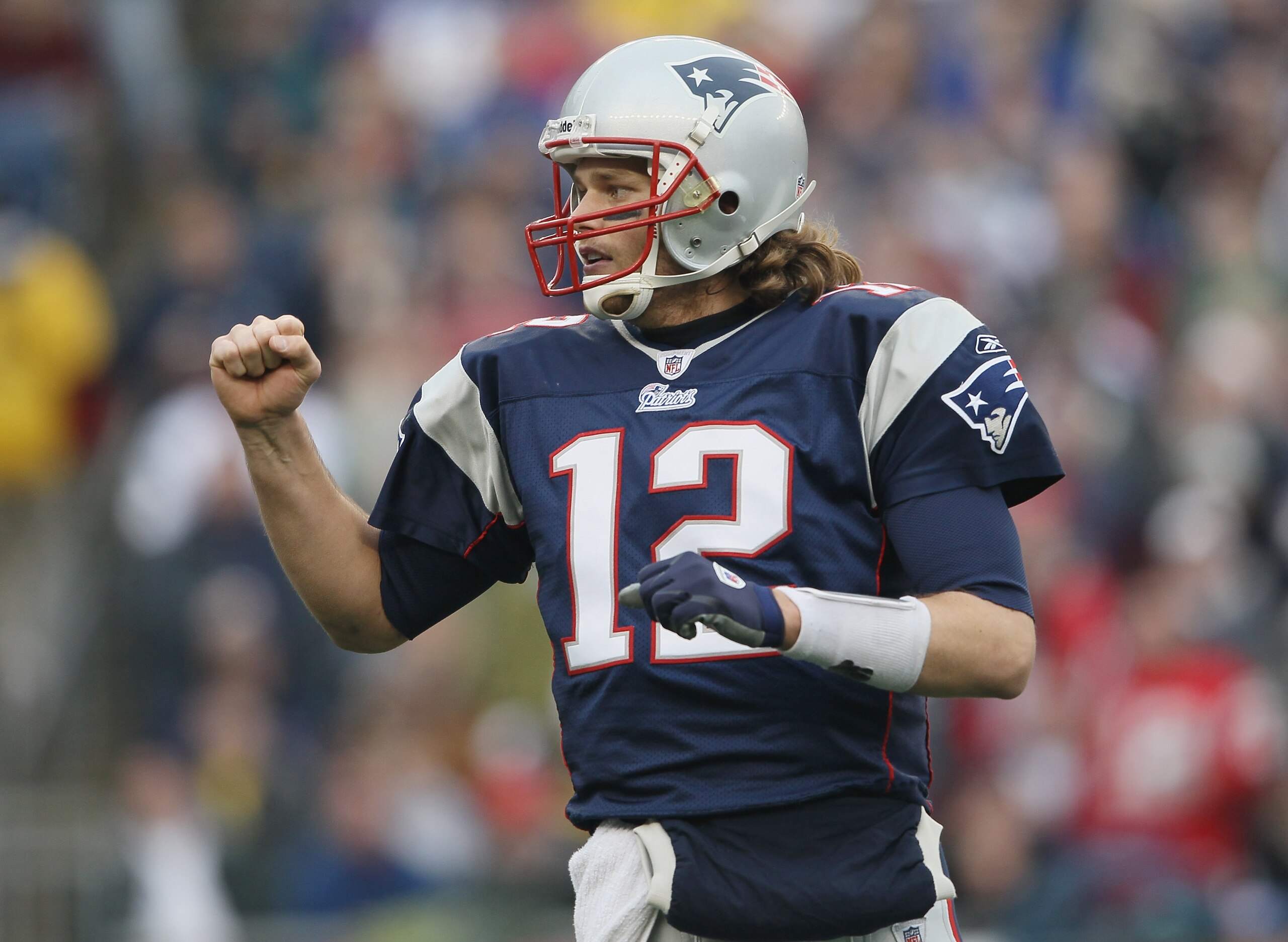 FOXBORO, MA - JANUARY 02:  Tom Brady #12 of the New England Patriots celebrates a touchdown by teammate BenJarvis Green-Ellis in the first quarter against the Miami Dolphins on January 2, 2011 at Gillette Stadium in Foxboro, Massachusetts.  (Photo by Elsa