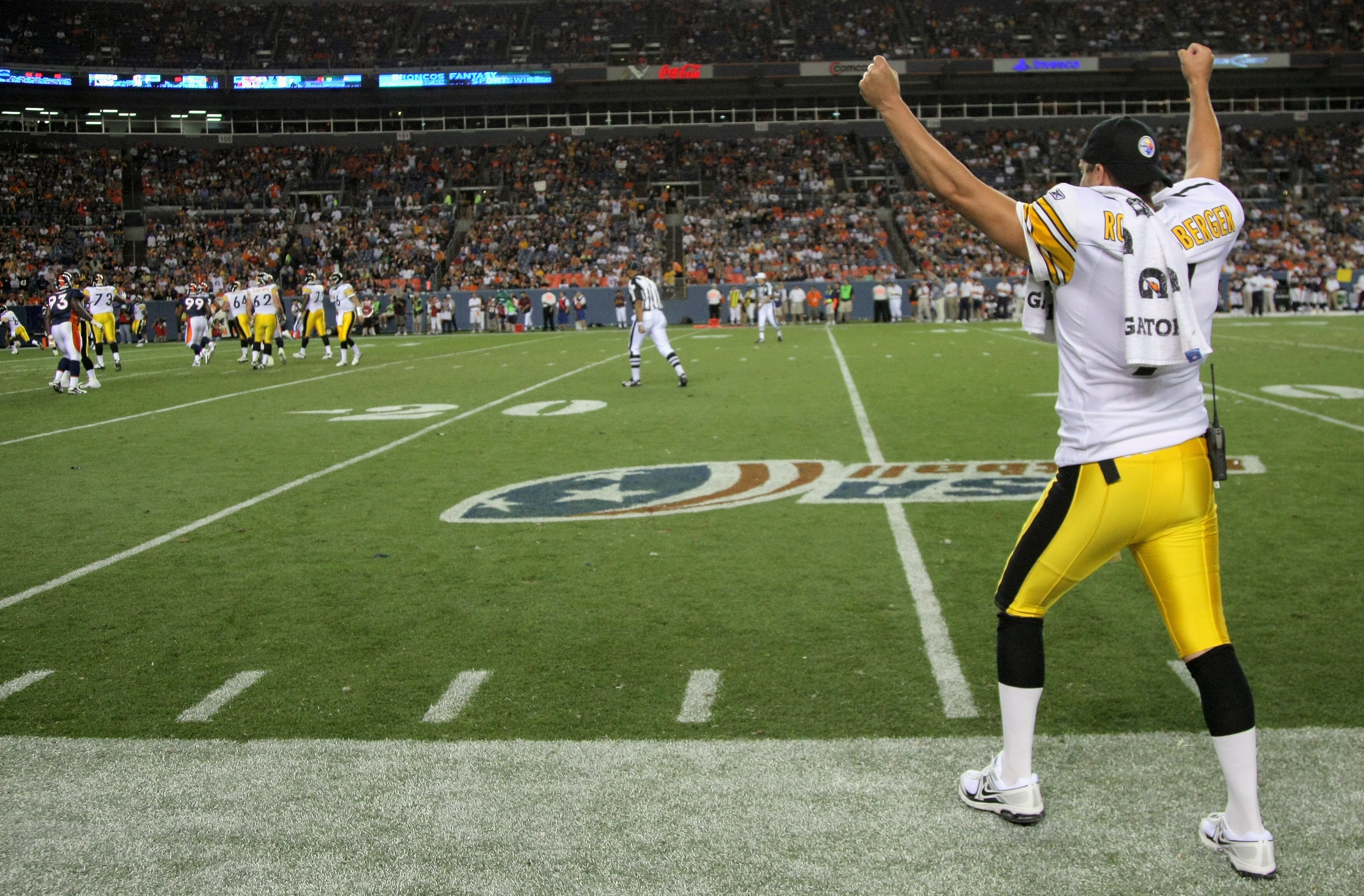 DENVER - AUGUST 29:  Quarterback Ben Rothlisberger #7 of the Pittsburgh Steelers cheers for his teammates from the sideline as they score a touchdown against the Denver Broncos during preseason NFL action at INVESCO Field at Mile High on August 29, 2010 i
